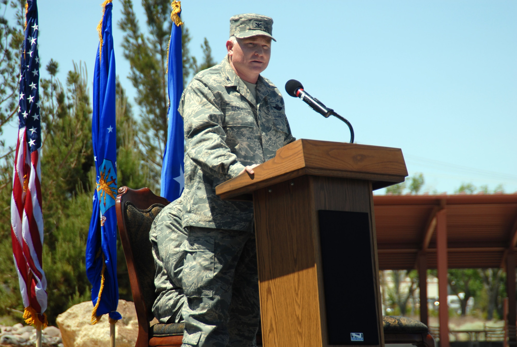 Col. Jerry Gandy, 95th Air Base Wing commander, talks to Team Edwards during his appointment to command ceremony at the building 3000 parking lot here May 16. Colonel Gandy succeeds Col. Bryan Gallagher, who died Feb. 5. (Air Force photo by Senior Airman Julius Delos Reyes)