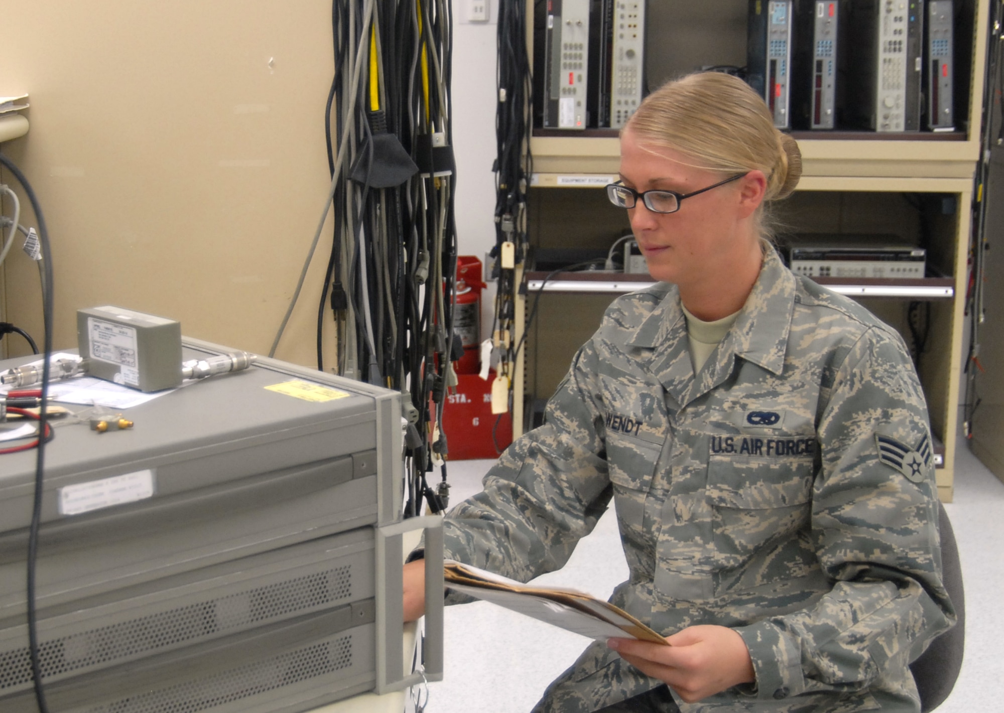 Senior Airman Melissa Wendt, 412th Maintenance Squadron precision measurement equipment laboratory technician, performs a test  on a calibration machine. Airman Wendt is one of 37 Airmen Air Force-wide who will attend the the Tri-Service Physician Assistant program at Fort Sam Houston, Texas, in April 2009.  (Air Force photo by Airman 1st Class William O’Brien)