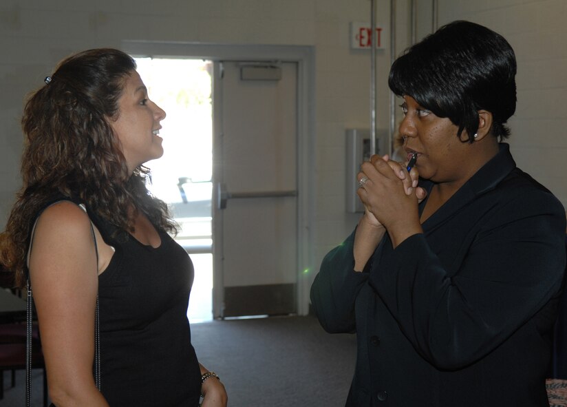 Kathy Harrigian, wife of 49th Fighter Wing Commander, Col. Jeff Harrigian, shares information she learned from the deployment expo with Shirley Bratton, Committee Readiness Consultant assigned to the Airman and Family Readiness Center. The Deployment Expo is a briefing to provide information to both single and married military members and families about pre-deployment, deployment, and post deployment support.  The Deployment Expo was held at the Community Activity Center, May 13, Holloman Air Force Base, N.M.

(U.S. Air Force photo/Senior Airman Anthony Nelson Jr)
