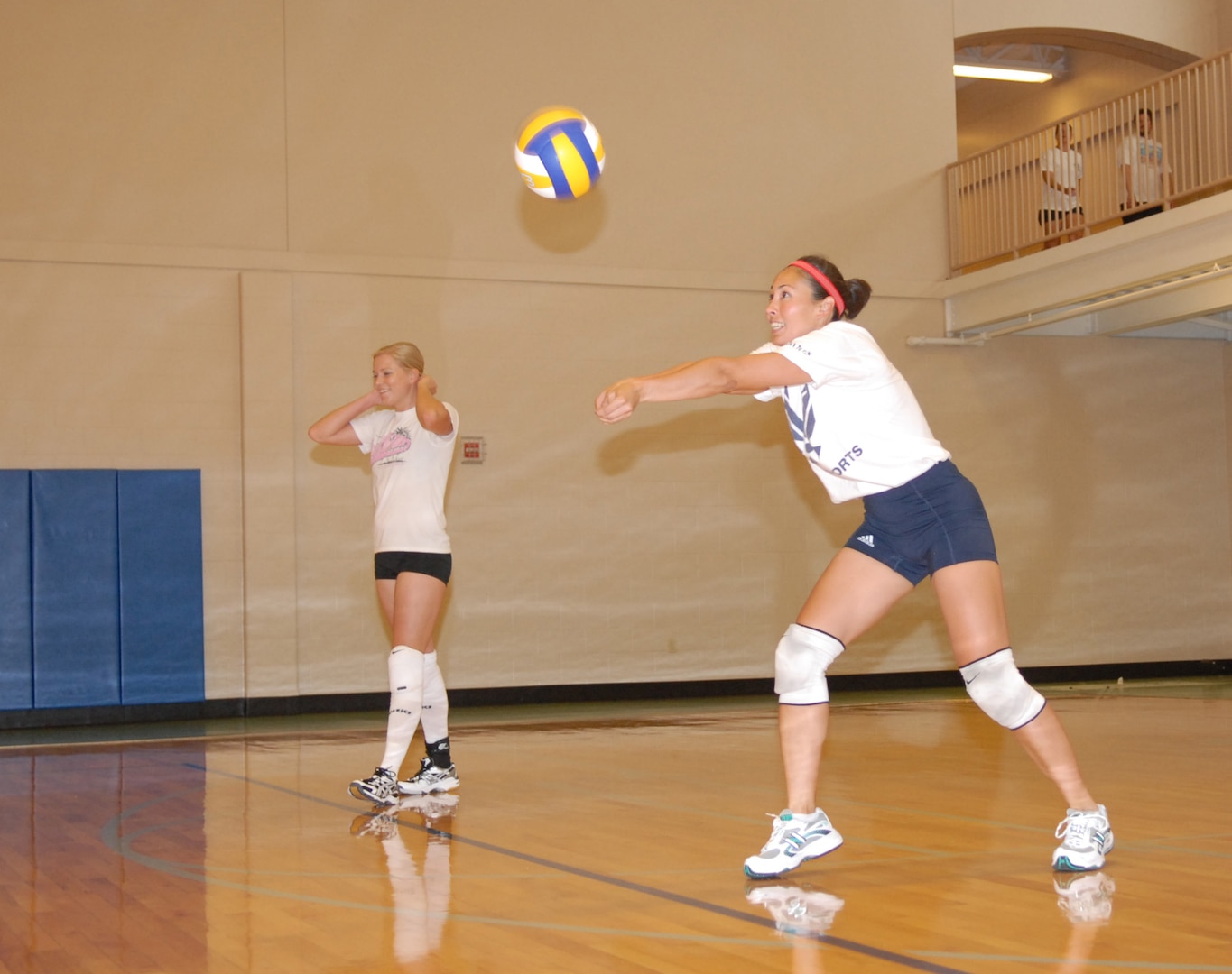 Monkia Johncour, 563rd Flying Training Squadron student flight commander, digs a volleyball during an unofficial volleyball practice at the Rambler Fitness Center here Wednesday. The Air Force Volleyball team is holding their annual camp and tryouts this year at Randolph, for athletes across the Air Force to earn a spot on the Air Force-level team, which will compete against our sister services in competition.
(U.S. Air Force photo by Rich McFadden)