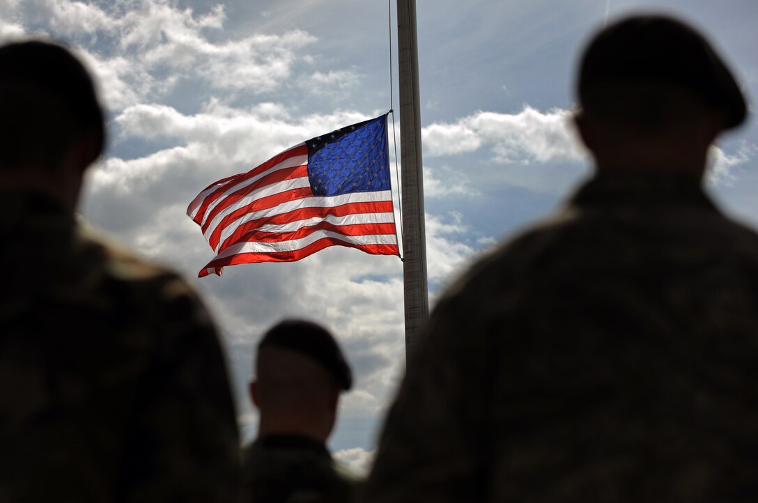 Members of the 28th Security Forces Squadron stand in formation during the National Peace Officers Memorial Day retreat ceremony here, May 15. The National Peace Officers Memorial Day honors all the local, state, and federal law enforcement officers who serve and protect; the flag was lowered to half-staff in honor of those who have fallen. (U.S. Air Force photo/Senior Airman Marc I. Lane)
