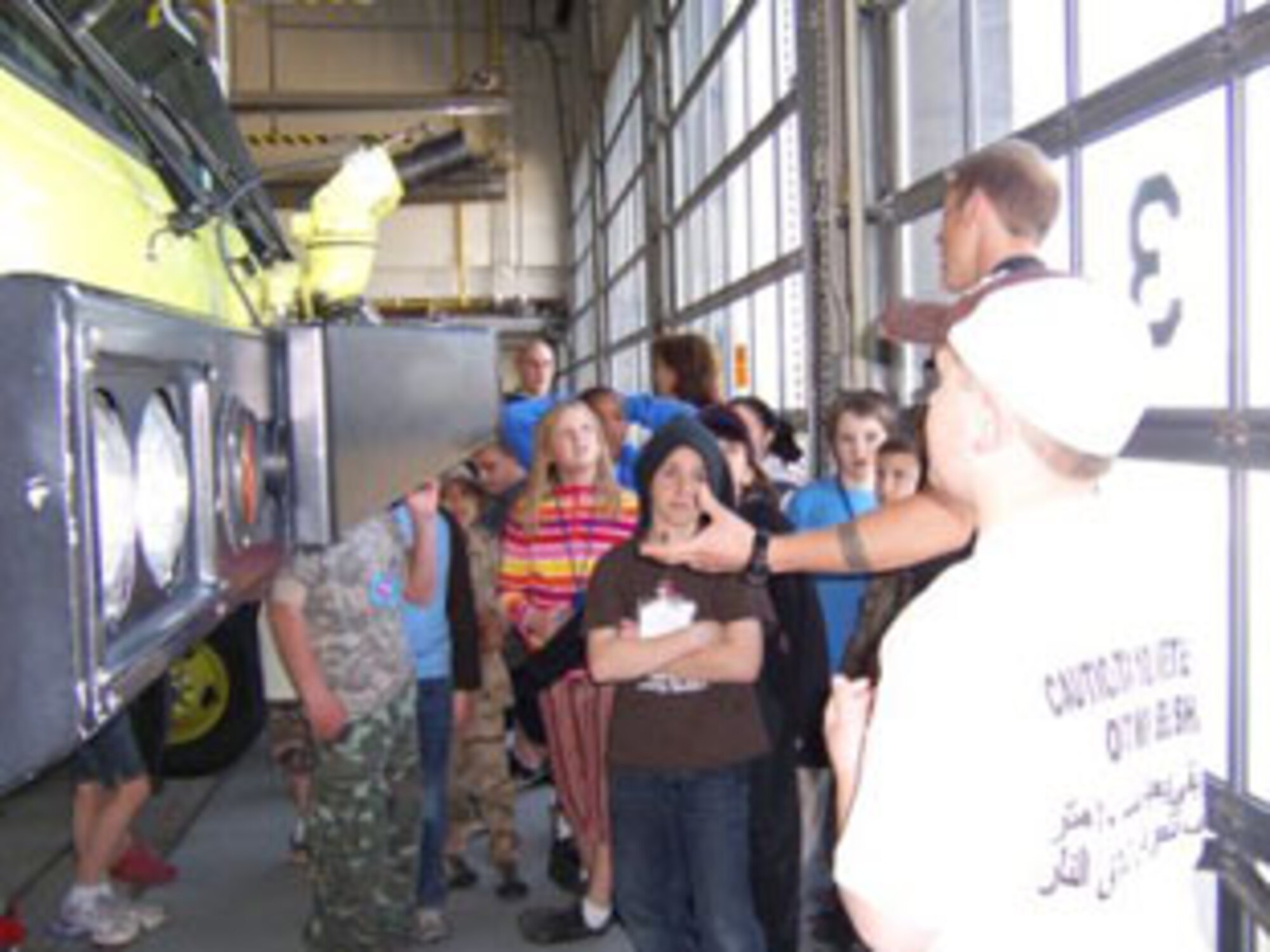 SSgt. Nolan P. Mooney, 174th Fighter Wing Fire Protection Apprentice shows the  discusses the fire trucks
