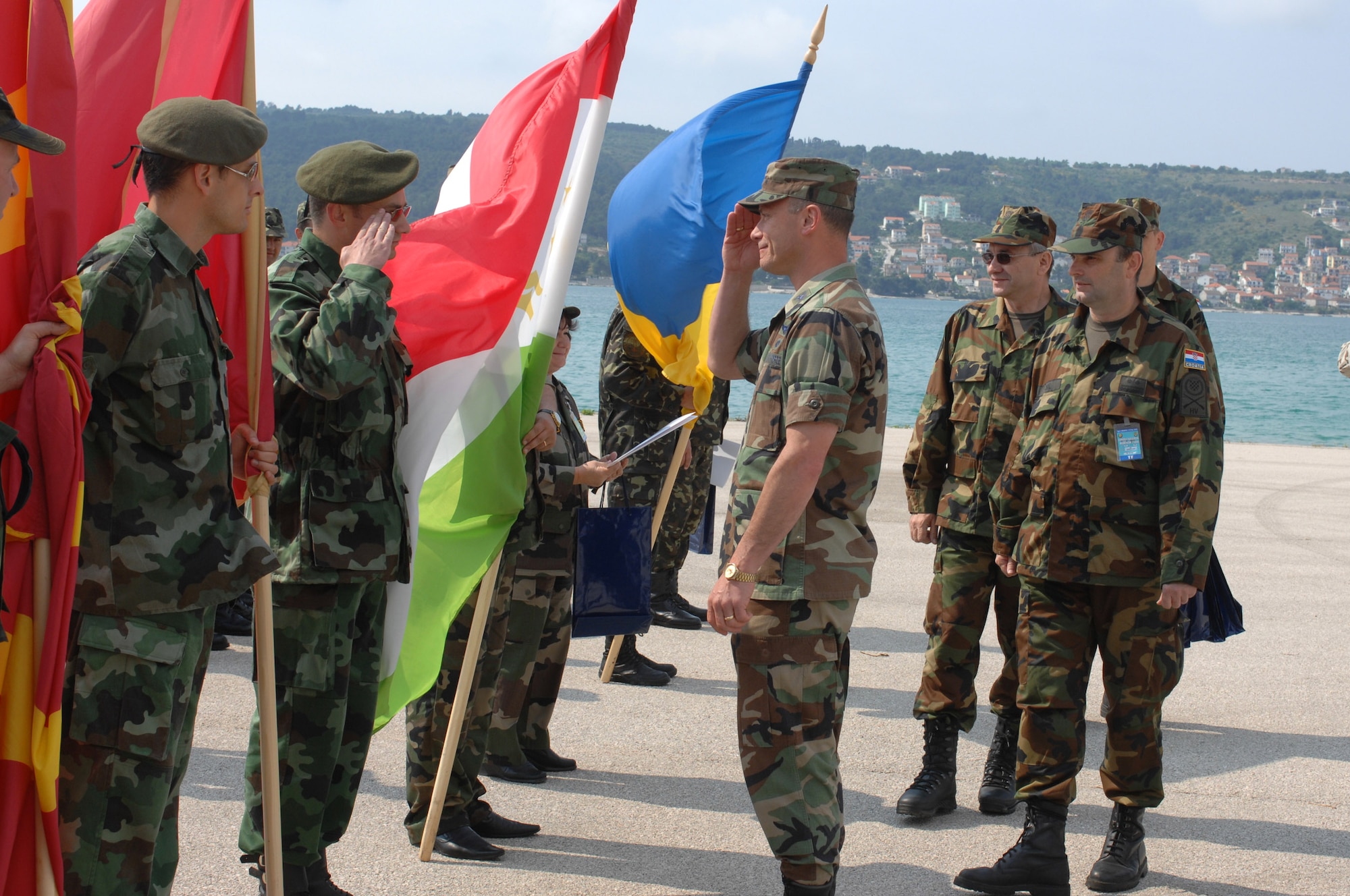 Col. Kevin Ross gives a final salute May 14 to the Albanian delegation chief as Croatian army Lt. Col. Davorko Jokic looks on during the closing ceremony of the 2008 Medical Training Exercise in Central and Eastern Europe, or MEDCEUR, at the Divulje Training Base in Croatia.  Colonel Ross is the MEDCEUR commander.  Colonel Jokic is the MEDCEUR co-commander.  (U.S. Air Force photo/Staff Sgt. Kristin Ruleau) 