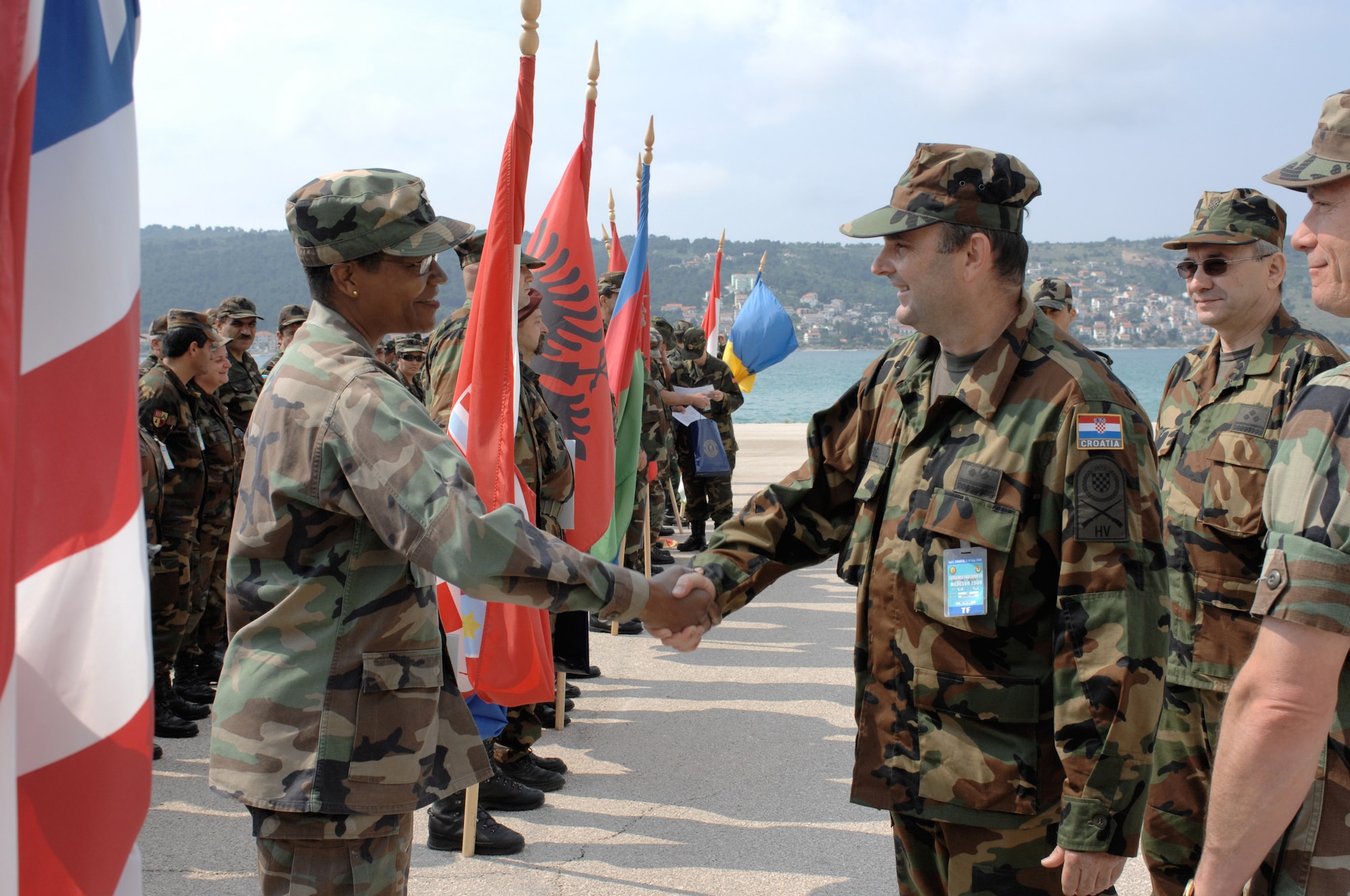 Croatian army Lt. Col. Davorko Jokic bids farewell to U.S. Air Force Col. Angela Thompson May 14 during the closing ceremony of the 2008 Medical Training Exercise in Central and Eastern Europe, or MEDCEUR, at the Divulje Training Base in Croatia.  Colonel Jokic is the MEDCEUR co-commander.  Colonel Thompson is the 458th Expeditionary Medical Squadron commander. (U.S. Air Force photo/Staff Sgt. Kristin Ruleau)