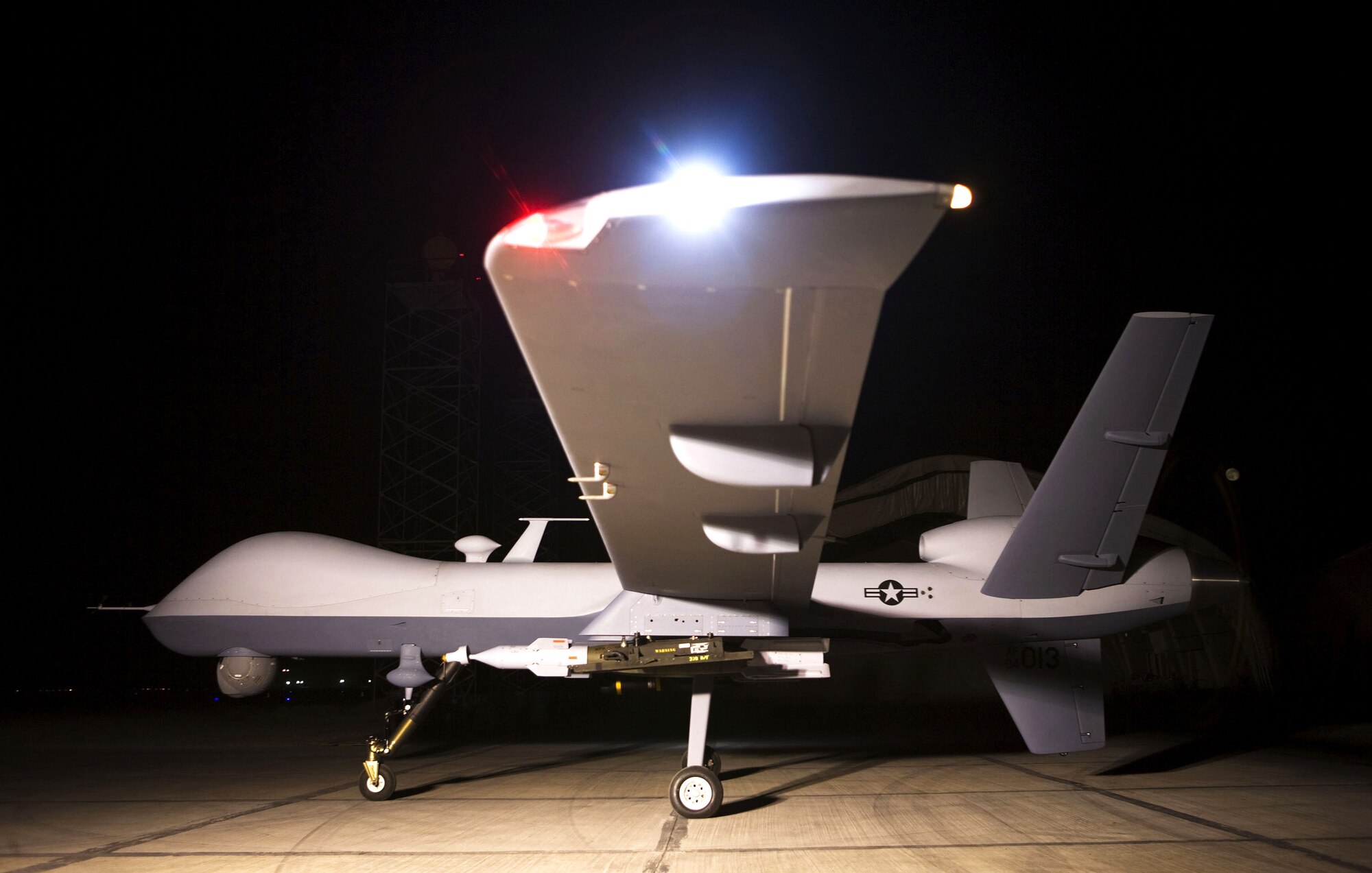 An MQ-9 Reaper sits on a ramp in Afghanistan. Larger and more powerful than the MQ-1 Predator, the Reaper is designed to go after time-sensitive targets with persistence and precision, and destroy or disable those targets (Courtesy Photo)
