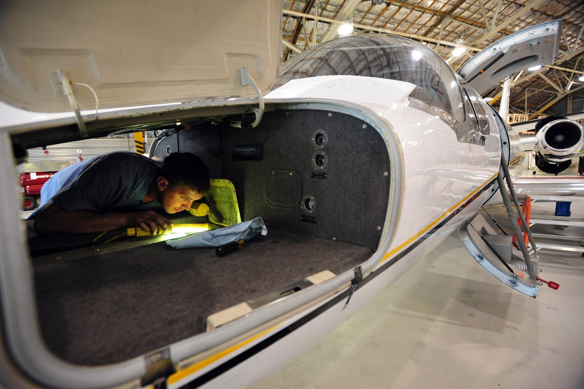 ELMENDORF AIR FORCE BASE, Alaska -- Jeff Kiecker, a UC-35 mechanic, Alaska Regional Flight Center, inspects the front landing gear strut at Elmendorf Air Force Base, Alaska May 12, 2008. The UC-35 has been a key asset in moving personnel and gear for Northern Edge. This joint exercise is designed to sharpen the military skills in preparation for a real world crisis. (U.S. Air Force Photo by Airman 1st Class Jonathan Steffen)
