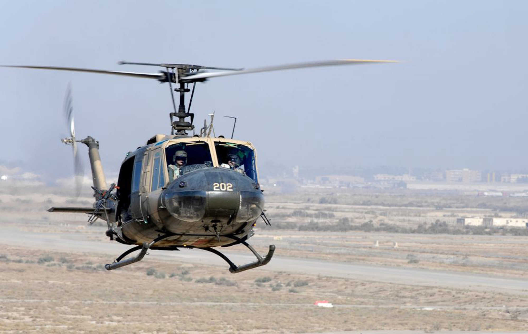 An Iraqi aircrew flies an Iraqi air force Huey II in support of ground operations in Mosul. Members of the Iraqi air force have increased its role during three missions to include Mosul, Sadr City and Bosrah. (U.S. Air Force photo) 
