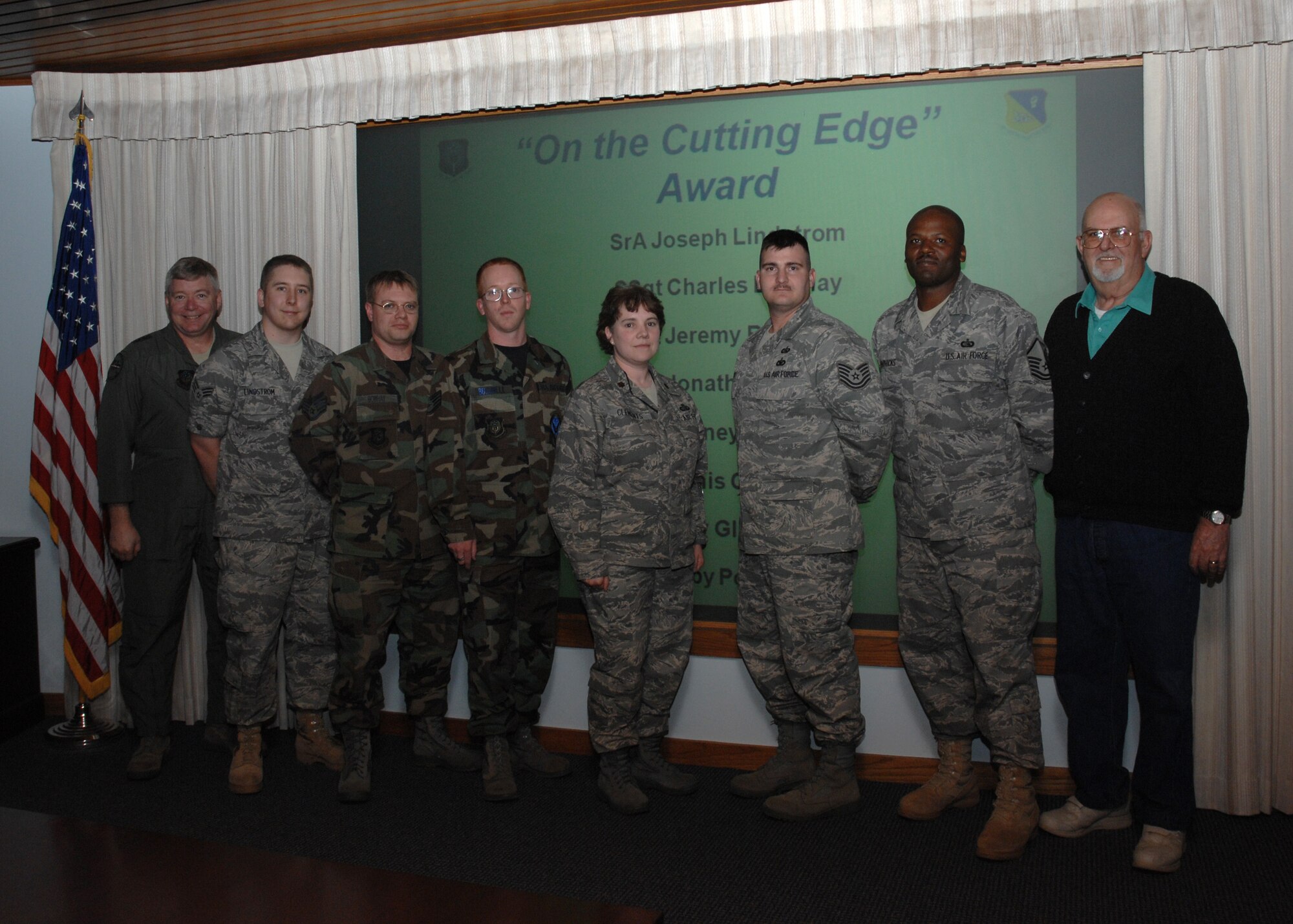 CANNON AIR FORCE BASE, N.M. - (left to right) Maj. Gen. Kurt A. Cichowski, Air Force Special Operations Command vice commander, recognizes Senior Airman Joseph Lindstrom, Staff Sgts. Charles Bowhay and Jeremy Bushnell, Maj. Stacy Clemens, 27th Special Operations Communications Squadron commander, Tech. Sgt. Jonathan Dauzat, Master Sgt. Rodney Hendrick, and Mr. Dennis Chambers. The Airmen and Mr.Chambers, all with the 27th SOCS, were recognized May 15 by General Cichowski for accomplishing command goals and improving the work environment. (U.S. Air Force/Airman 1st Class Evelyn Chavez)