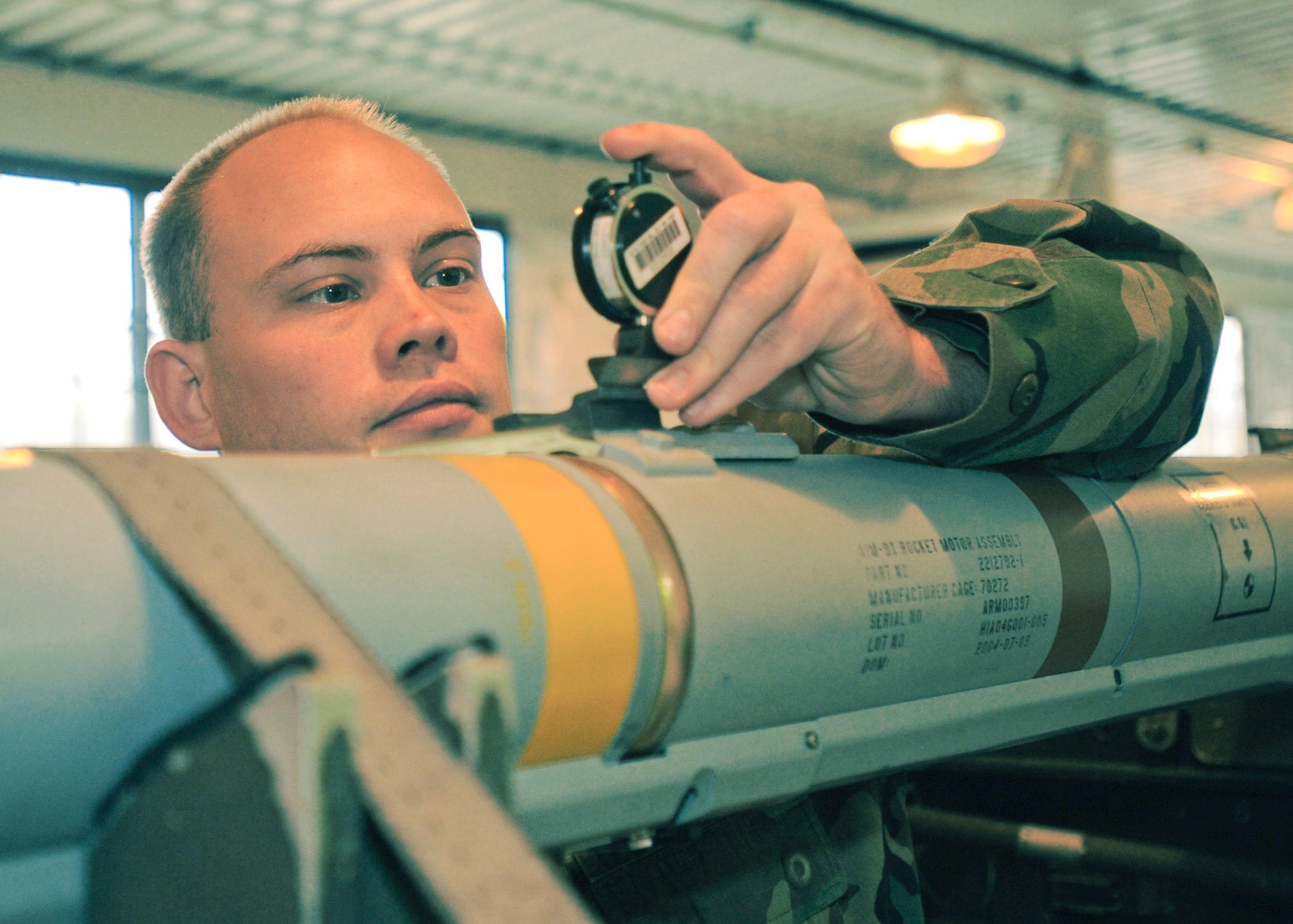 Staff Sgt. Wayne Zuiderhof checks the depth value on the forward hanger of a weapon May 14 at Elmendorf Air Force Base, Alaska. Sergeant Zuiderhof, assigned to the 3rd Equipment Maintenance Squadron Munitions Flight, was one of two recipients of the 2007 AIM-9X Cutting Edge Award. (U.S. Air Force photo/ Airman 1st Class Laura Turner) 
