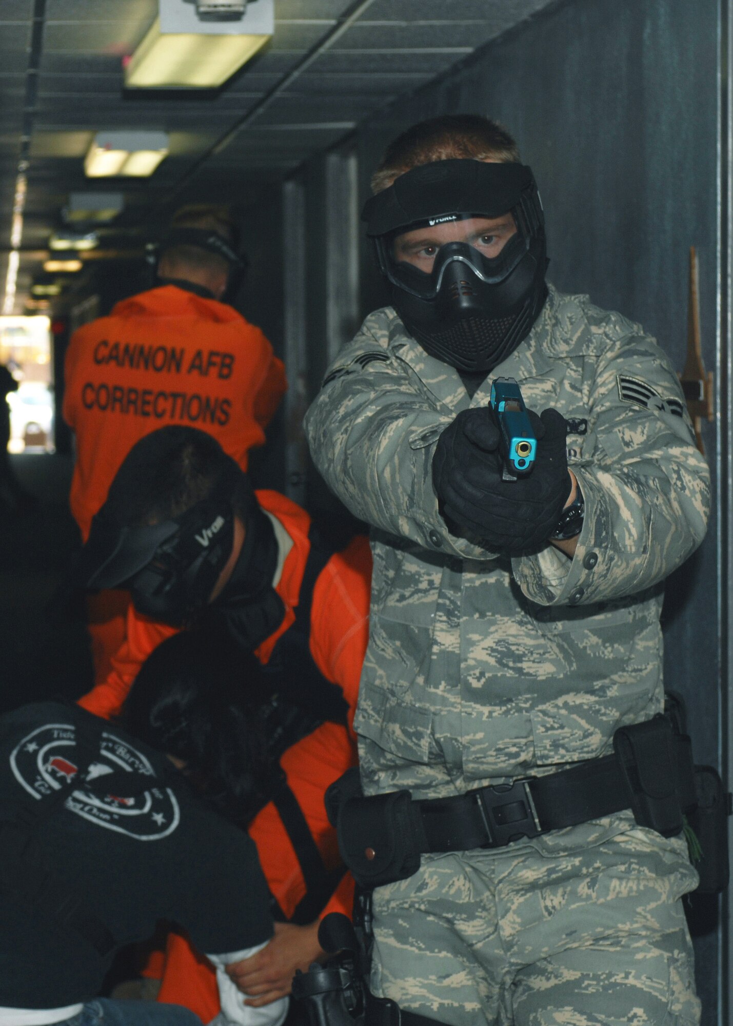 Senior Airman Joshua Jacobson is helped to safety by the rest of his four-man team during a training course May 7 at Cannon Air Force Base, N.M. The three-day Patrol Response to Active Shooter course is taught by National Tactical Officers Association members. Airman Jacobson is assigned to the 27th Special Operations Security Forces Squadron. (U.S. Air Force photo/Airman 1st Class James R. Bell) 