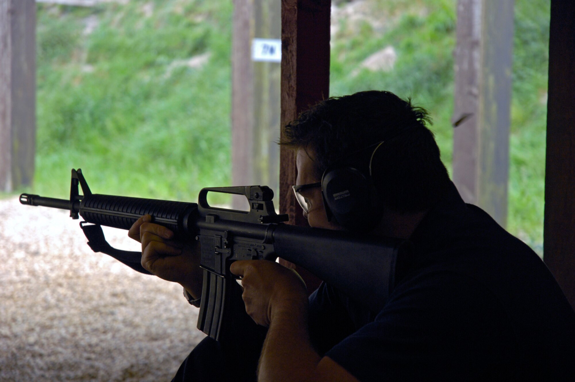 A Ministry Of Defense Police Officer fires an M-16 Rifle at the Combat Arms Training and Maintenance Course May. 15 at RAF Lakenheath. MOD and USAF personnel were scored according to accuracy and speed, during police week. (U.S. Air Force photo by Airman Perry Aston)