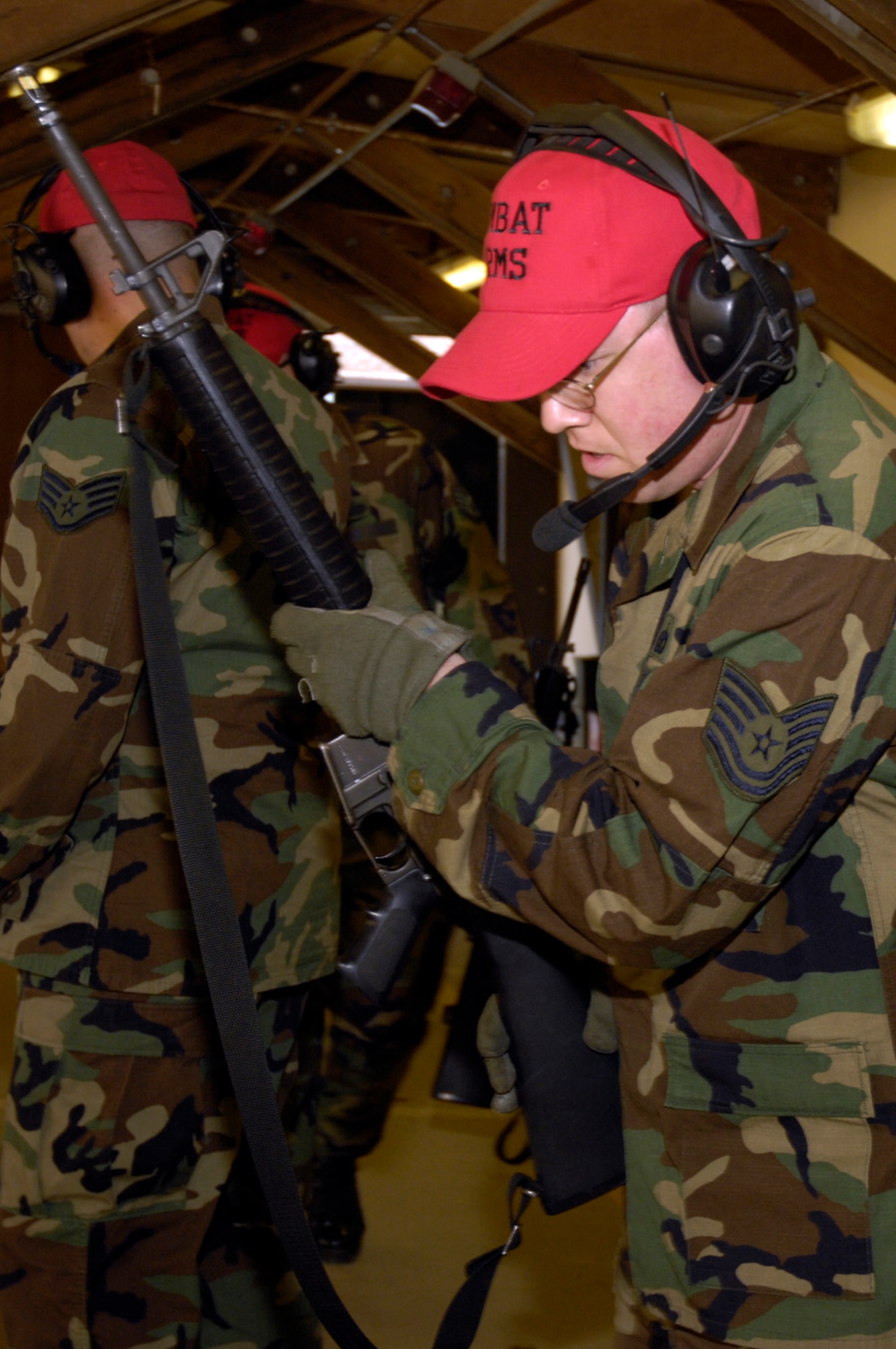 Tech Sergent Jason Dell, 48th Security Forces Squadron, Combat Arms Training and Maintenance Instructor gathers M-16's before the next group comes in to compete. May. 15 at RAF Lakenheath. MOD and USAF personnel were scored according to accuracy and speed at the CATM Course, during police week. (U.S. Air Force photo by Airman Perry Aston)