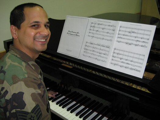 Staff Sergeant Mateo Ayala, clarinetist with the Air Force Band of Liberty, displays his award winning composition. Sergeant Ayala won first prize in the Danza Composition Competition, an annual contest sponsored by the Puerto Rico Senate and the Institute for Puerto Rican Culture (IPC). (Courtesy Photo.)