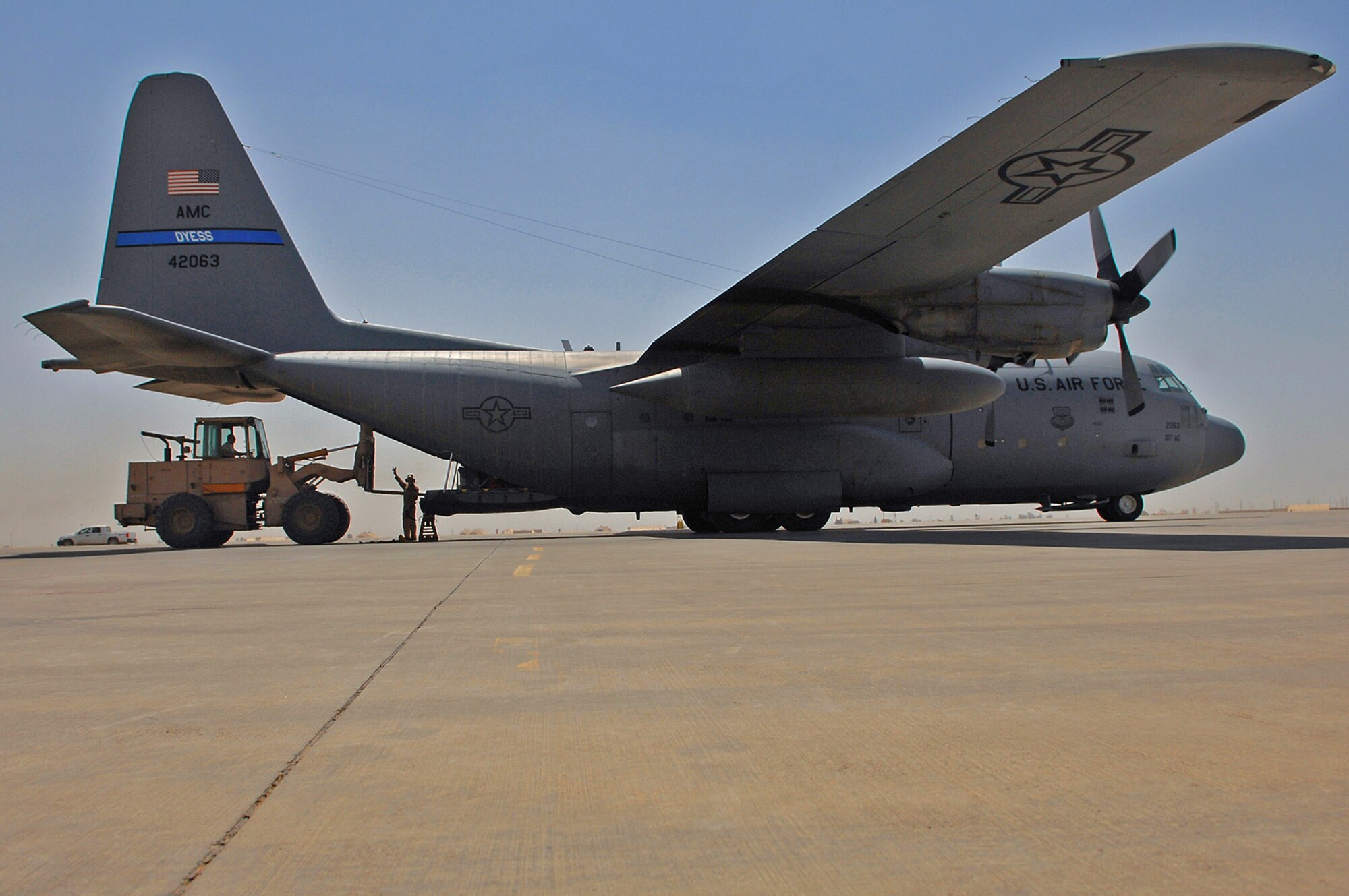 Cargo is loaded onto a C-130 Hercules May 10 at Balad Air Base, Iraq. Members of the 777th Expeditionary Airlift Squadron help prevented convoy vehicles and servicemembers from traveling along improvised explosive device-laden Iraqi roads by airlifting troops and supplies throughout the area of operations. (U.S. Air Force photo/Senior Airman Julianne Showalter)
