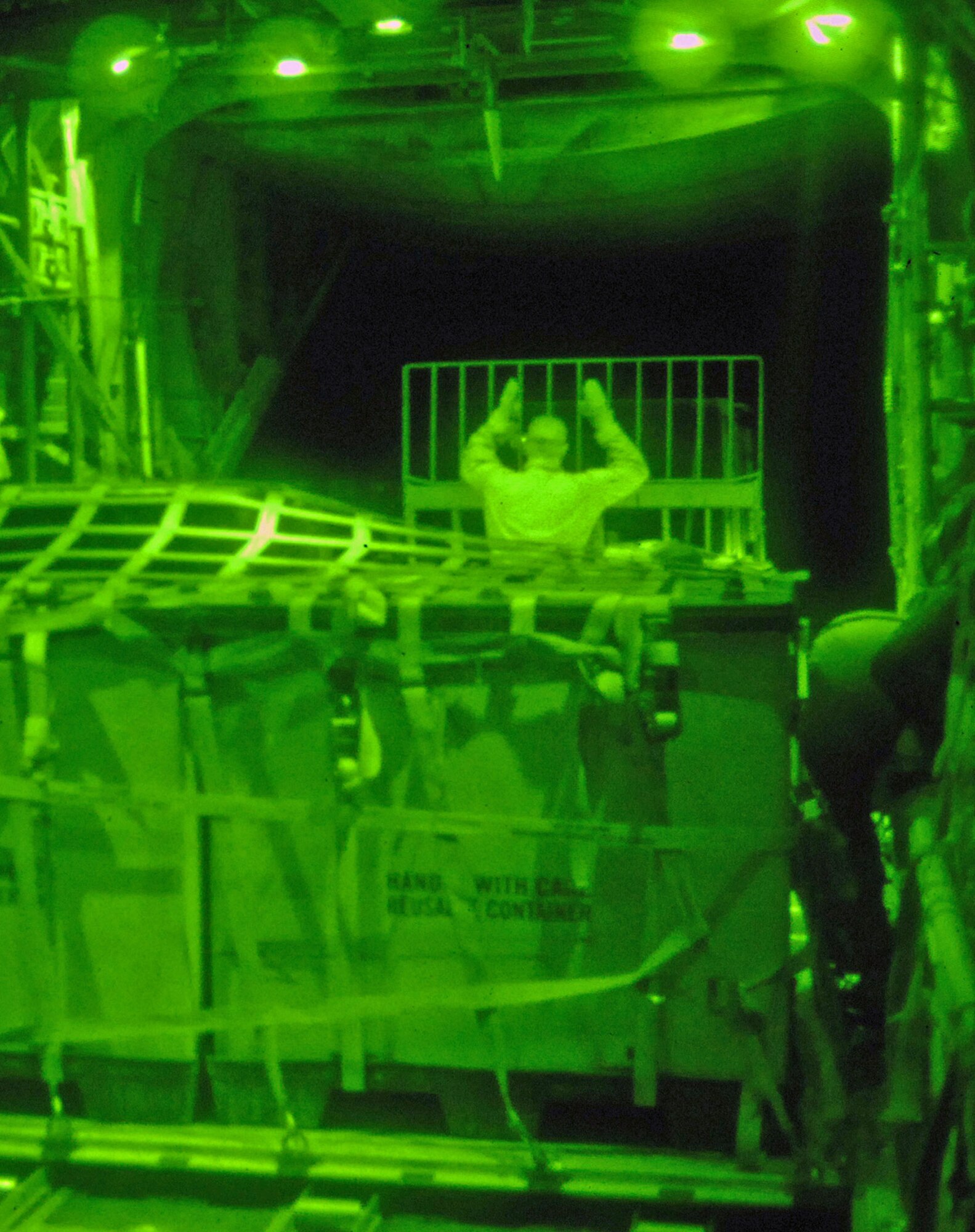 Staff Sgt. Ronnie James ushers a pallet of cargo into a C-130 Hercules during a combat mission May 7 at Balad Air Base, Iraq. Members of the 777th Expeditionary Airlift Squadron help prevented convoy vehicles and servicemembers from traveling along improvised explosive device-laden Iraqi roads by airlifting troops and supplies throughout the area of operations. Sergeant James is a 777th EAS loadmaster deployed from Little Rock Air Force Base, Ark. (U.S. Air Force photo/Senior Airman Julianne Showalter) 
