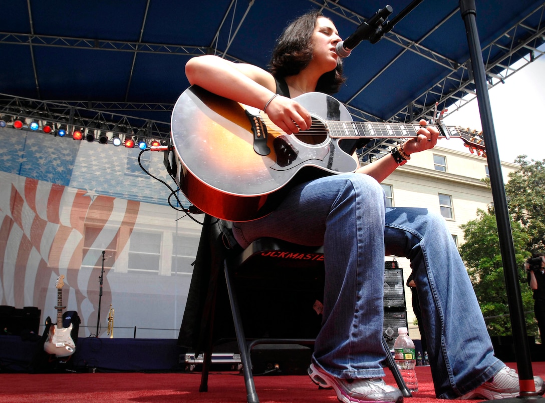 "The Lt. Dan Band" member Gina Gonzalez sings her tribute to the troops, "The Letter Home," during the 4th Annual America Supports You Military Tribute Concert at the Pentagon Courtyad May 16, 2008.