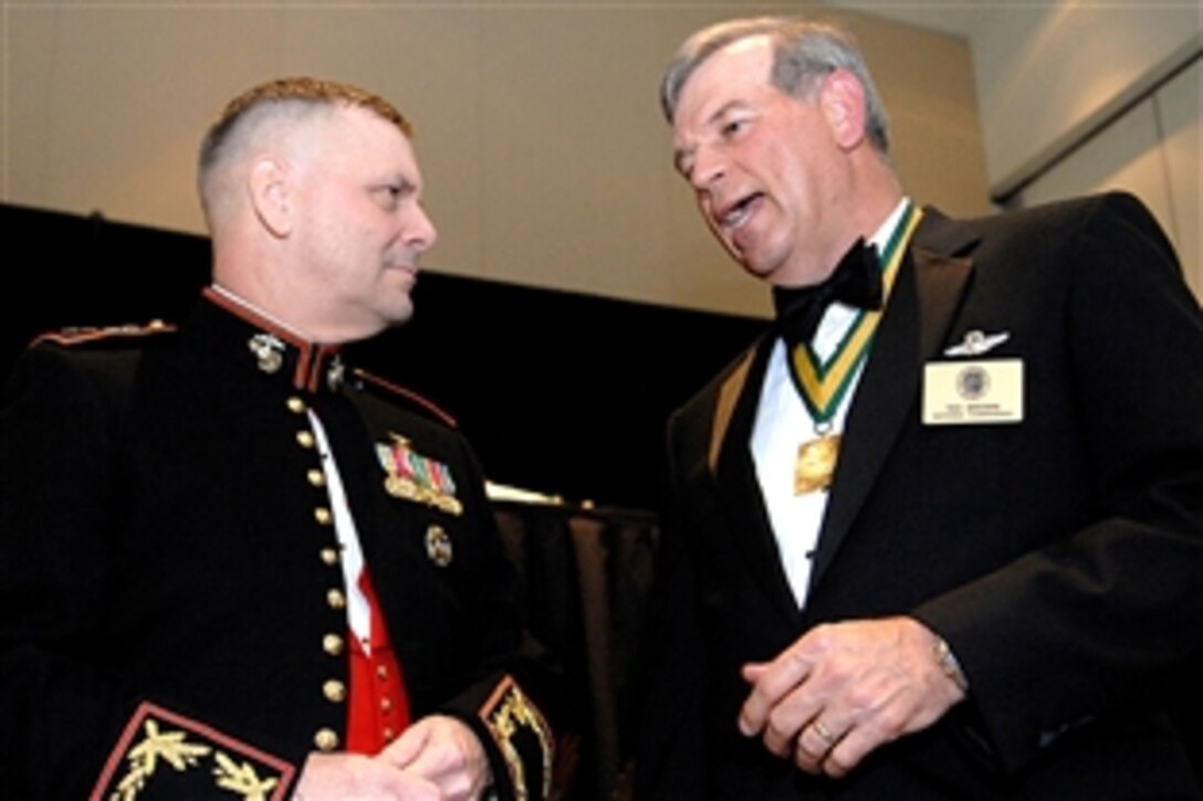 Vice Chairman of the Joint Chiefs of Staff Marine Gen. James E. Cartwright talks with retired Air Force Lt. Gen. Richard "Tex" Brown at the 2008 Daedalian Awards dinner at Fort Walton Beach, Fla., May 15, 2008. Cartwright was the keynote speaker, presenting awards to military pilots. 