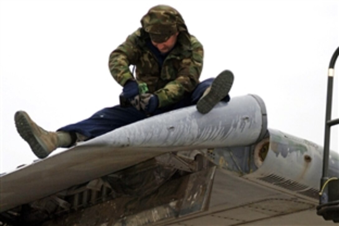 U.S. Air Force Tech. Sgt. Amos Salisbury replaces aileron panels on a C-141 Starlifter aircraft at Mid-America Airport in Mascoutah, Ill., May 15, 2008. The aircraft is one of five that will be on permanent display as part of the Scott Field Heritage Airpark at Scott Air Force Base, Ill. Salisbury is a crew chief assigned to the 653rd Combat Logistics Support Squadron. 