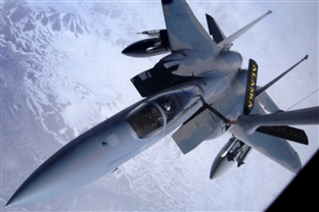 An F-15E Eagle receives jet fuel at almost 30,000 feet above the ground from an Alaska Air National Guard 168th Air Refueling Wing KC-135 Stratotanker boom over the Pacific Alaska Range Complex during a training mission in support of Northern Edge 2008, May 14, 2008. Alaska's size enables the military to train in the largest air-land-sea training complex in America.

