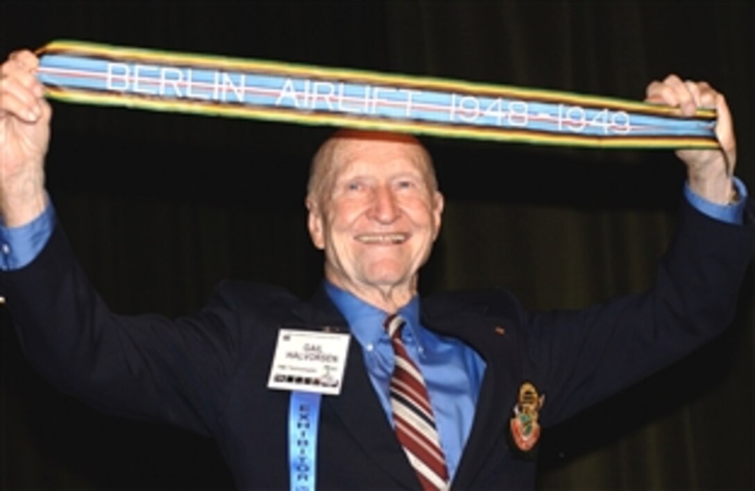 One of the lasting memories of the Berlin Airlift is the image of now-retired Lt. Col. Gail S. Halvorsen, nicknamed the "candy bomber" for his habit of dropping chocolate bars tied to tiny hankerchief-sized parachutes from his plane to the children of West Berlin as he flew supplies into Tempelhof Airport. Halvorsen is scheduled to speak during the 2008 Joint Services Open House at Andrew Air Force Base, Md., this weekend. Here, Halvorsen displays the newly authorized Berlin Airlift streamer pre