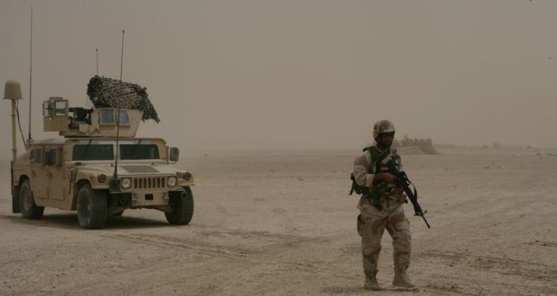 RAMADI, IRAQ (May 16, 2008) - An Iraqi Army Soldier guides a Humvee out of a sandstorm during OPERATION SPRING BREAK near the south side of Lake Tharthar in al Anbar Province May 13.  The purpose of the operation was to disrupt suspected insurgent movement. The south side of Lake Tharthar has seen a scarce amount of interaction with Coalition forces since 2004, while the north has been more heavily patrolled. â??No one has been on the south side of Lake Tharthar for almost two years and there was a possibility insurgents were using the area as a safe haven and transportation hub,â? said Maj. Jeff McCormack, the operation officers for 1st Battalion, 9th Marine Regiment, Regimental Combat Team 1. â??The mission was to disrupt insurgent movement and also establish relationships with the local fisherman.â? (Official U.S. Marine Corps photo by Lance Cpl. Adam J. Root/Released)