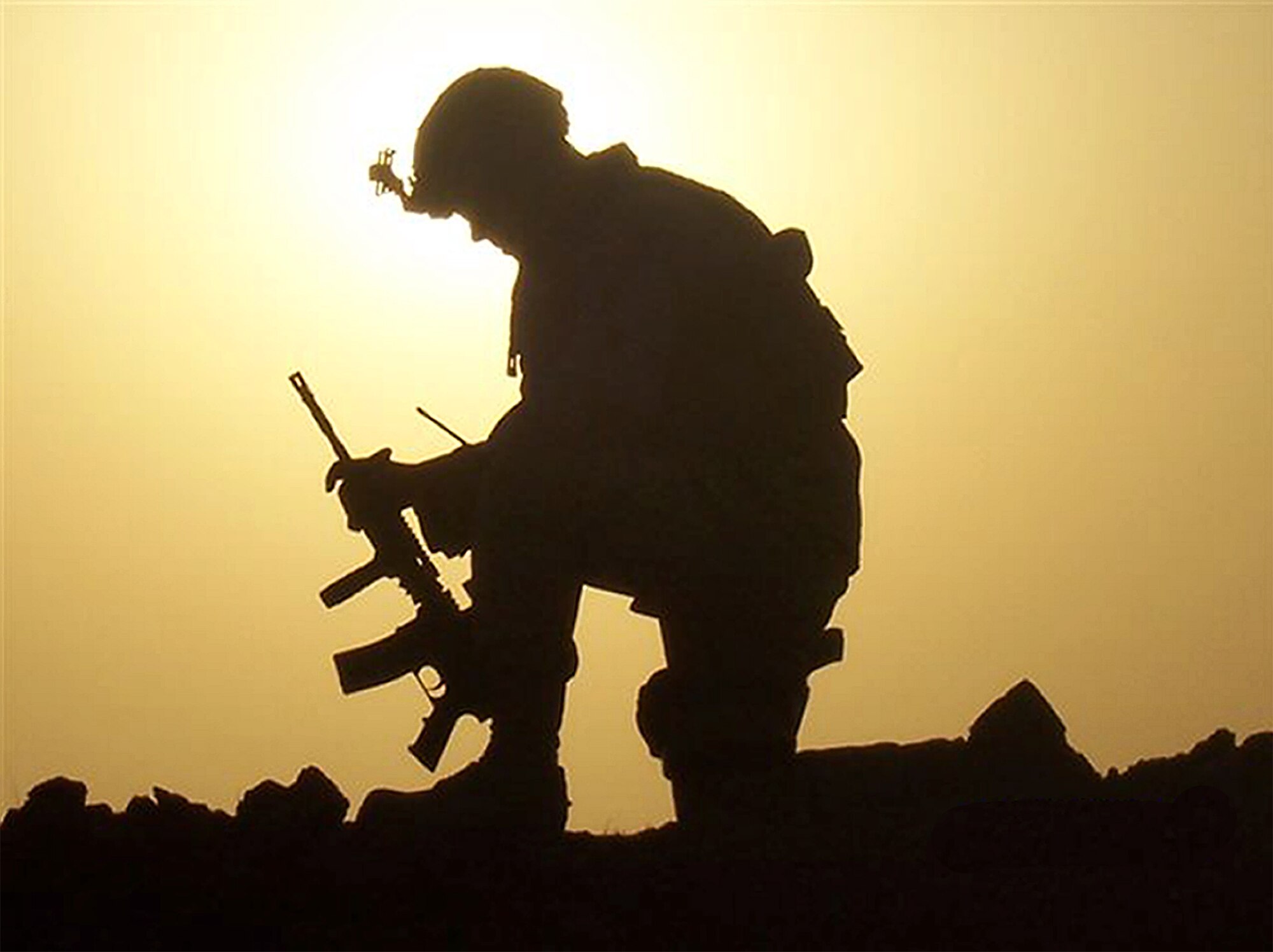 Tech. Sgt. Craig Gall, a 442nd Security Forces Squadron fire-team leader, is silhouetted by the setting sun while on duty in Iraq. Twenty-six 442nd SFS members were deployed to Kirkuk Regional Air Base from August 2007 until March of this year. The 442nd SFS is part of the 442nd Fighter Wing, an Air Force Reserve Command A-10 Thunderbolt II unit based at Whiteman Air Force Base, Mo.  (US Air Force photo/Courtesy 442nd Security Forces Squadron)