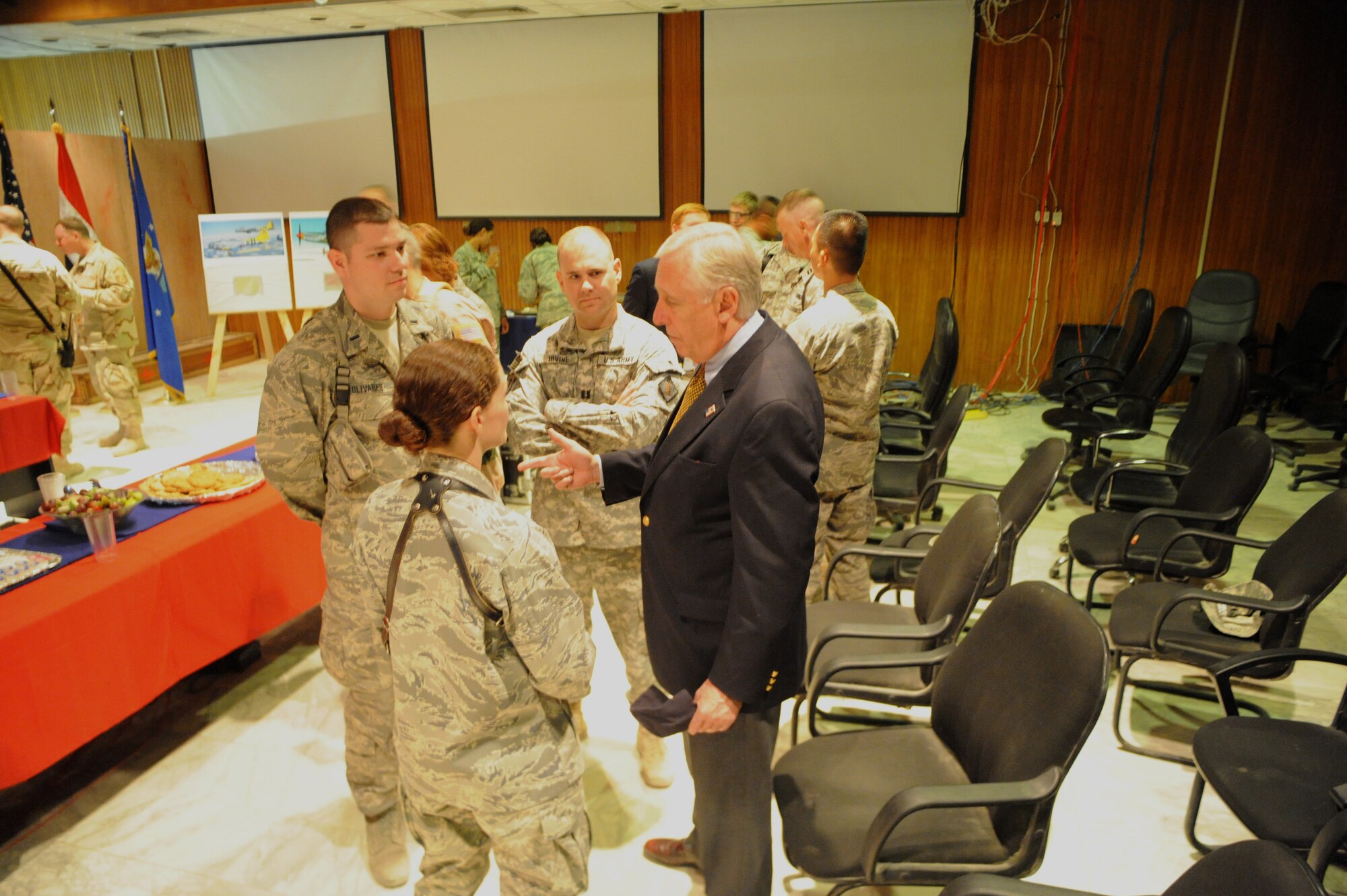 SATHER AIR BASE, Iraq -- Rep. Steny Hoyer (right) speaks with 1st Lt. Julian Olivares (left), 447th Expeditionary Medical Squadron, Army Capt. Zachary Irvine, and 1st Lt. Emily Cole, 447th Expeditionary Operations Support Squadron during a visit with deployed Airmen and Soldiers here May 17. (U.S. Air Force photo/Tech. Sgt. Amanda Callahan)