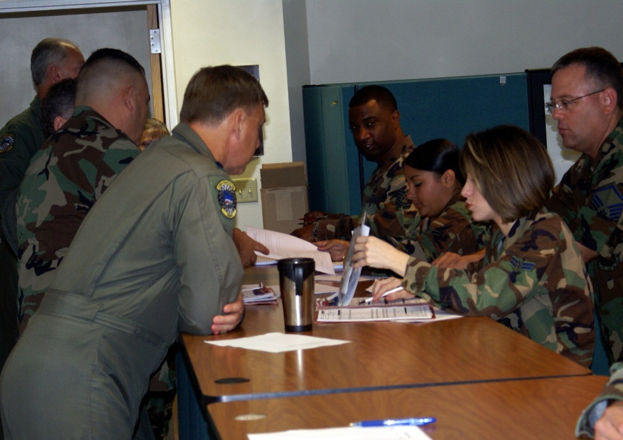 482nd Mission Support Squadron members process reservists through a deployment line to ensure proper documentation in preparation for a two-week deployment to train with the Bulgarian Air Force on May 17. Next month, about 200 reservists will deploy to Bulgaria for the exercise as an aviation package with pilots, operations, maintenance and support personnel, which include fuels, avionics, and administration specialists, among others. (U.S. Air Force photo/Senior Airman Erik Hofmeyer)