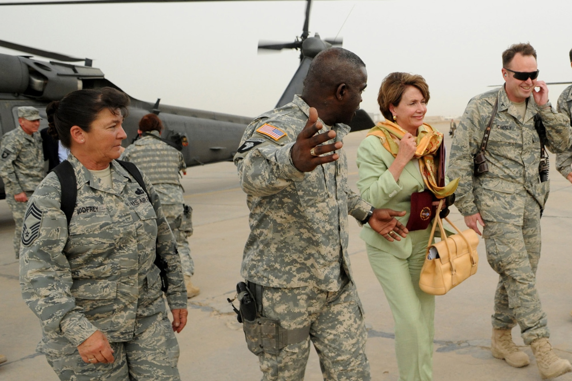 SATHER AIR BASE, Iraq -- Col. Fred Cheney (right), 447th Air Expeditionary Group commander, along with Chief Master Sgt. Kathryn Godfrey (left), 447th Air Expeditionary Group superintendent and Command Sgt. Maj. Marvin Hill, Command Sergeant Major, Multi-National Force - Iraq, lead Speaker of the House, Nancy Pelosi, to meet Airmen and Soldiers of Sather Air Base May 17. (U.S. Air Force photo/Tech. Sgt. Amanda Callahan)