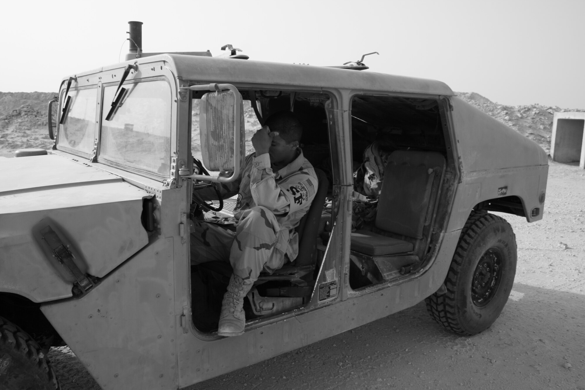 Staff Sgt. Royal Manning pauses to reflect on the sacrifices his fellow security forces and office of special investigation brethren have made in the Global War on Terrorism.  The 379th Expeditionary Security Forces Squadron conducted a “Final Guardmount” May 15 to honor fallen U.S. Security Forces defenders during National Police Week.  (U.S. Air Force photo/Senior Airman Travis Acevedo)