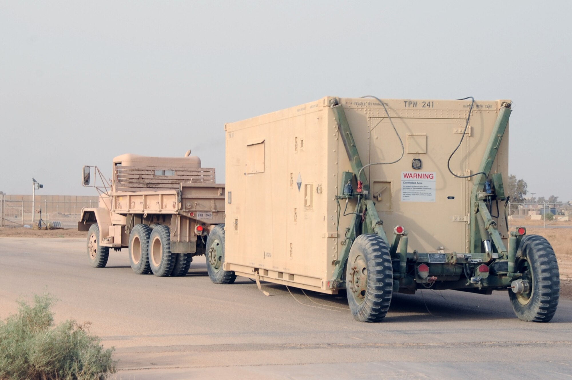 ALI BASE, Iraq -- The 407th Expeditionary Communications Squadron radar technician's team, drives away with the shelter containing the TPN-19 radar here May 13.  The radar will be transported to Tobyhanna Army Depot to be refurbished before being returned to the 54th Combat Communications Squadron at Robins AFB, Ga.  (U. S. Air Force photo / Tech. Sgt. Sabrina Johnson)
