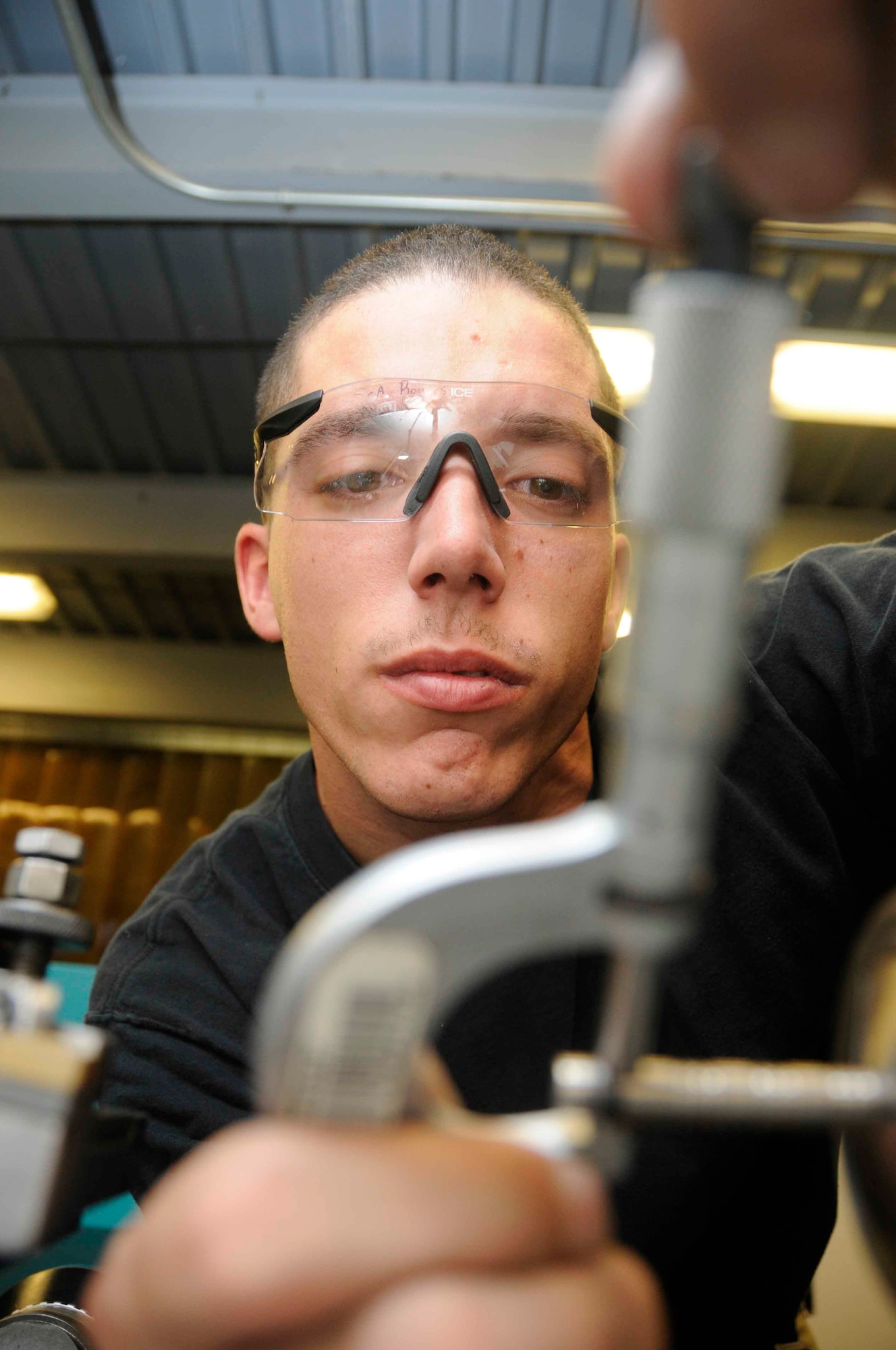Senior Airman Michael Rogers, 379th Expeditionary Maintenance Squadron metals technician, makes an alignment to a pin that is used on the KC-135 May 14. The alignment will improve the angle of attack measurement for the KC-135. Metals technicians can sculpt metal to form tools and parts used to repair aircraft. They provide parts for mission requirements in lieu ordering parts from a non-military source.(U.S. Air Force photo/ Senior Airman Domonique Simmons)
