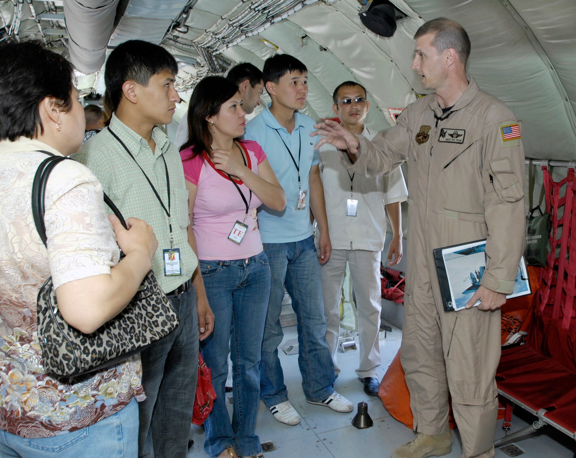 (08/05/16)  Senior Master Sgt. Phil Frank, 22nd Expeditionary Air Refueling Squadron, Manas Air Base, Kyrgyz Republic, points out the features of a U.S. KC-135 aircraft to Kyrgyz military members during a base tour.  The group toured various facilities and were briefed on the base mission. (U.S. Air Force/SSgt Tabitha Kuykendall)