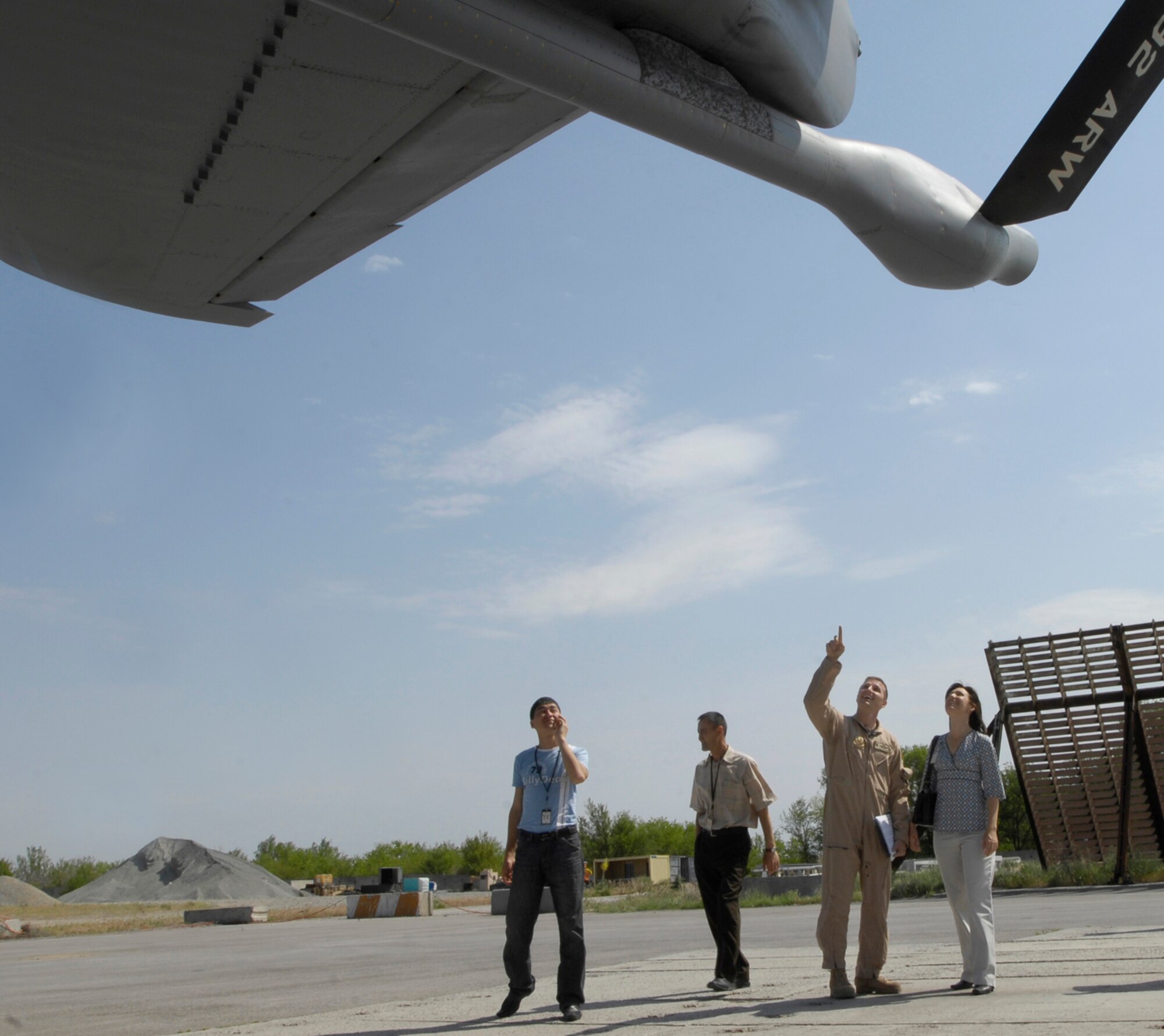 (08/05/16)  Senior Master Sgt. Phil Frank, 22nd Expeditionary Air Refueling Squadron, Manas Air Base, Kyrgyz Republic, points out the features of a U.S. KC-135 aircraft to Kyrgyz military members during a base tour.  The group toured various facilities and were briefed on the base mission. (U.S. Air Force/SSgt Tabitha Kuykendall)
