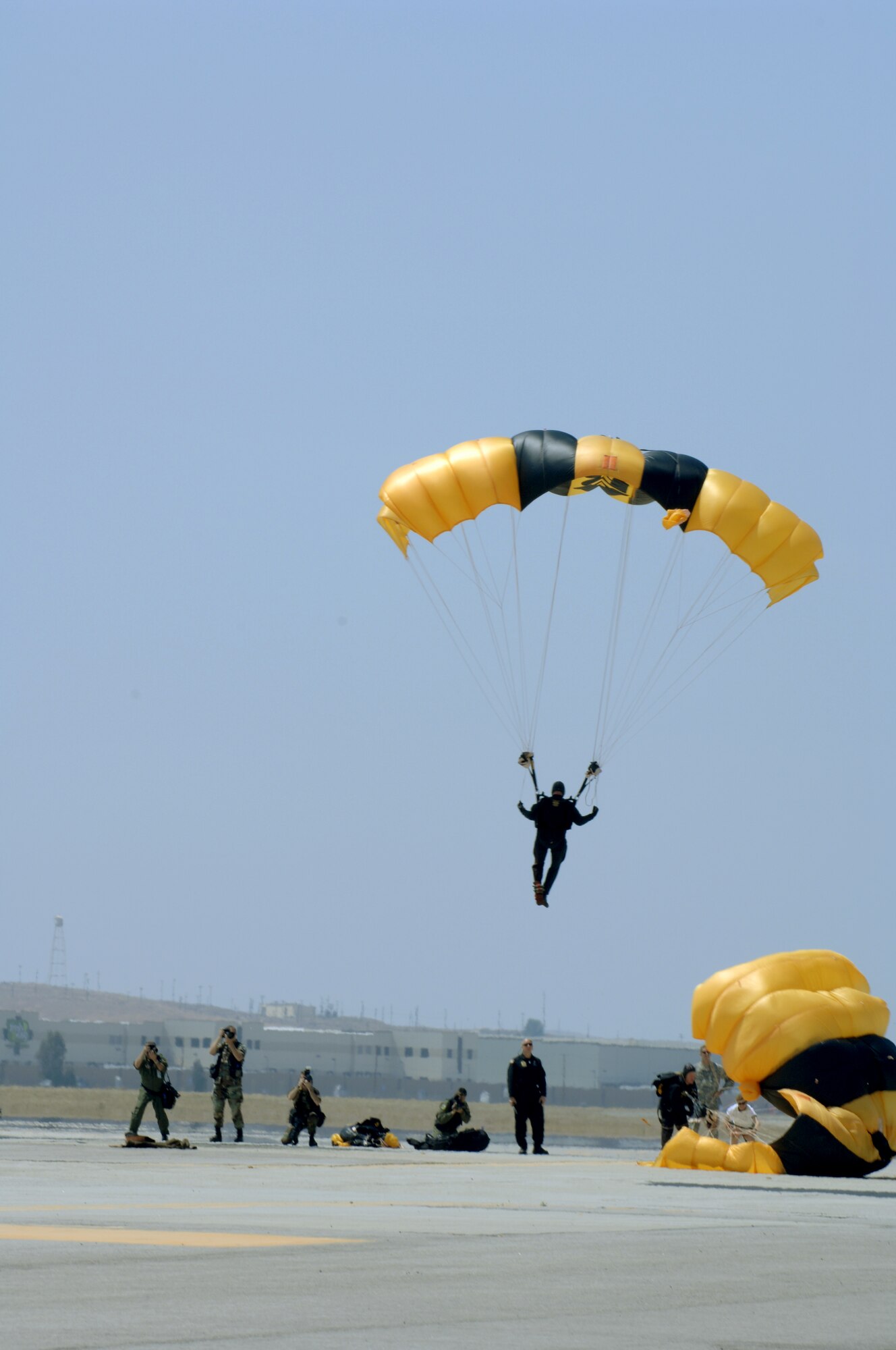Members of the Golden Knights Precision Parachute Team land on there targets during the March ARB AirFest '08. The AirFest featured both military and civilian aerial and ground demonstrations during the two day air show, May 3-4, 2008 at March Air Reserve Base, Riverside, California. (U.S. Air Force photo by SrA Dayton Mitchell) 