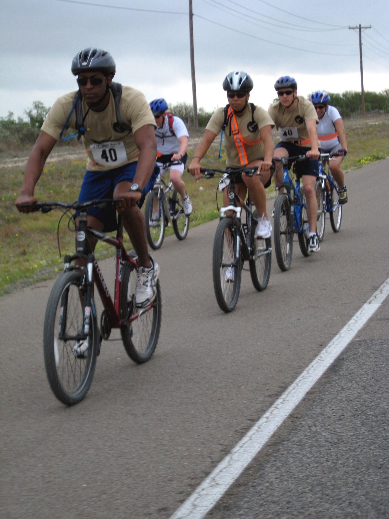 From left to right, 1st Lt. Brian Williams, Senior Airman Kamaile Chan, 2nd Lt. Joel Hansen and Col. Merrily Madero, Goodfellow Ninjas team members, complete the biking leg of the Laughlin Adventure Race April 26. (U.S. Air Force photo by Senior Airman Julio Brito)