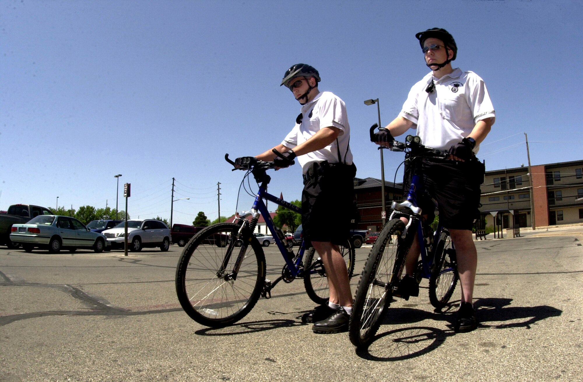 Senior Airman Michael Faulkner and Airman 1st Class Mikael Rose mount up as they prepare to go on patrol as members of the 17th Security Forces Squadron’s newly formed bike patrol team May 2. (U.S. Air Force photo by Senior Airman Luis Loza Gutierrez)