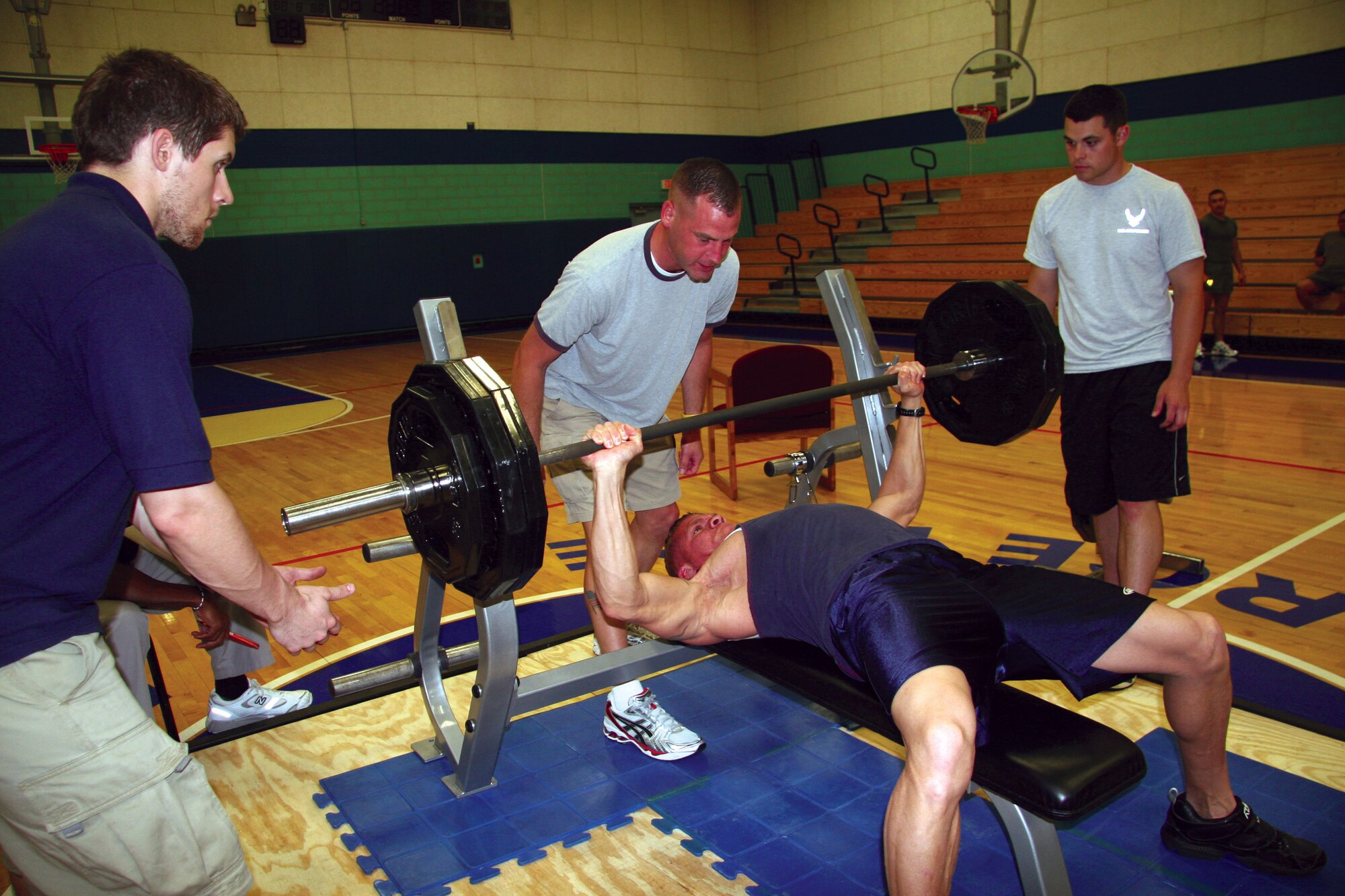 Cinco de Mayo Bench Press Challenge overall winner Jeffrey Velazquez pushes out 295 pounds during the competition May 5. He eventually added 10 more pounds to win the challenge. For more on the challenge, see page 9. (U.S. Air Force photo by Julie Manuel)