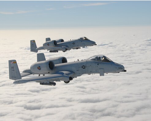Two A-10C attack jets of the Maryland Air National Guard's 104th Fighter Squadron fly a training mission over Maryland's Eastern Shore, Jun. 14, 2007  (Photo by Senior Master Sgt. Jim Foard).