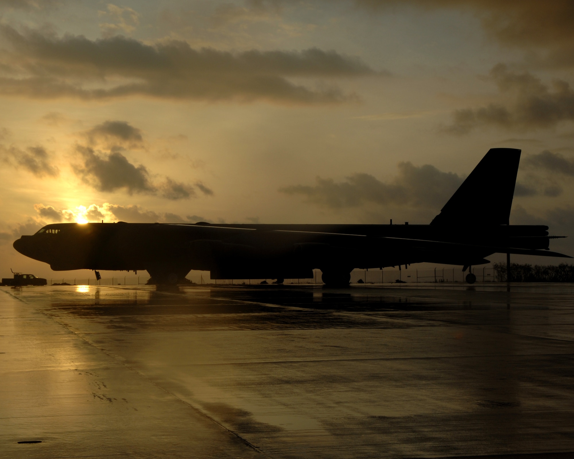 The sun rises over a B-52 Stratofortress Bomber assigned to the 96th Expeditionary Bomb Squadron May 15. The Bombers are deployed from Barksdale AFB, La. to provide the U.S. Pacific Command commander a continuous bomber presence in the Asia-Pacific region. (U.S. Air Force Photo by Airman 1st Class Cory Todd) 