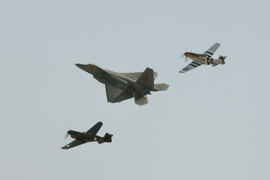 The F-22 Raptor performs a heritage flight with the P-51 and P-40 during AirFest '08. The air show featured both military and civilian aerial and ground demonstrations during the two day air show, May 3-4, 2008 at March Air Reserve Base, Riverside, California. (U.S. Air Force photo by SrA Dayton Mitchell) 