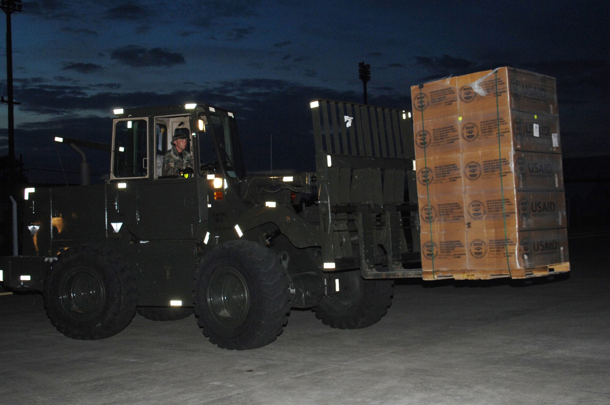 Utapao, Thailand - Staff Sgt Ryan Dawson, 36th Contingency Response Group, operates a forklift during the downloading of humanitarian relief supplies from a Boeing 747 commercial airplane for delivery into Burma May 16. SSgt Dawson is one of 45 members forward deployed from Andersen AFB, Guam. (USAF photo/Senior Airman Sonya Croston)(RELEASED)