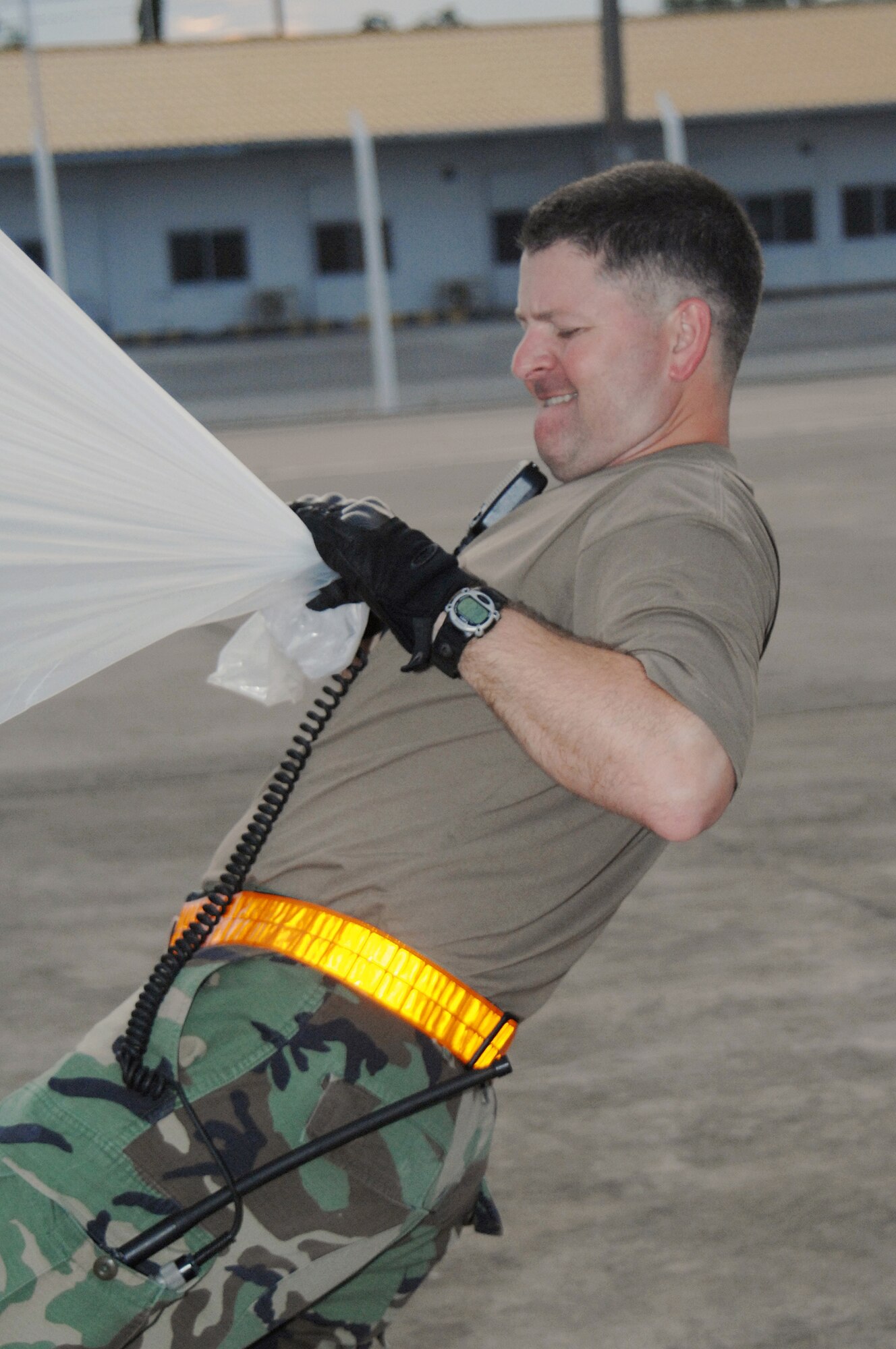 Utapao, Thailand - Master Sgt Jon Harston removes plastic lining from a pallet of humanitarian relief supplies being transferred from a Boeing 747 commercial airplane at Utapao Thai Royal Navy Air Base, Thailand to Burma May 16. MSgt Harston is forward deployed with the 36th Contingency Response Group from Andersen AFB, Guam. (USAF photo/Senior Airman Sonya Croston)(RELEASED)