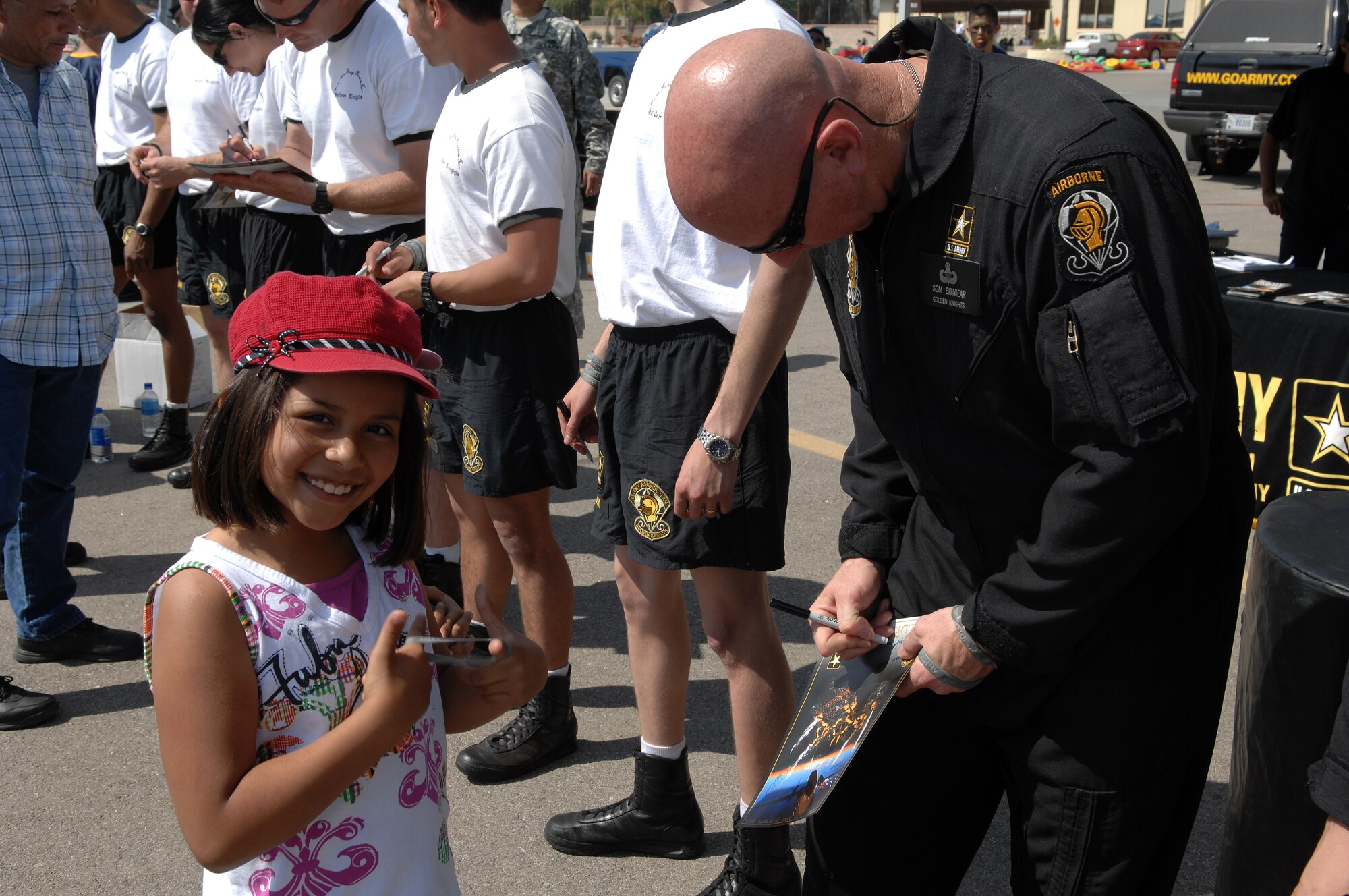 SGM Michael Eitniear of the U.S. Army “Golden Knights” Precision Parachute Team signs an autograph for a fan. AirFest '08 featured both military and civilian aerial and ground demonstrations during the two day air show, May 3-4, 2008 at March Air Reserve Base, Riverside, California. (U.S. Air Force photo by SrA Matthew Smith)