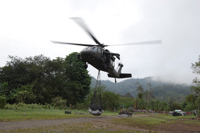 A UH-60 Blackhawk helicopter from Joint Task Force-Bravo lifts bridge materials from a pick-up point to be delivered to remote areas in Costa Rica. JTF-Bravo crews airlifted 184,000 pounds of materials between May 9-14.