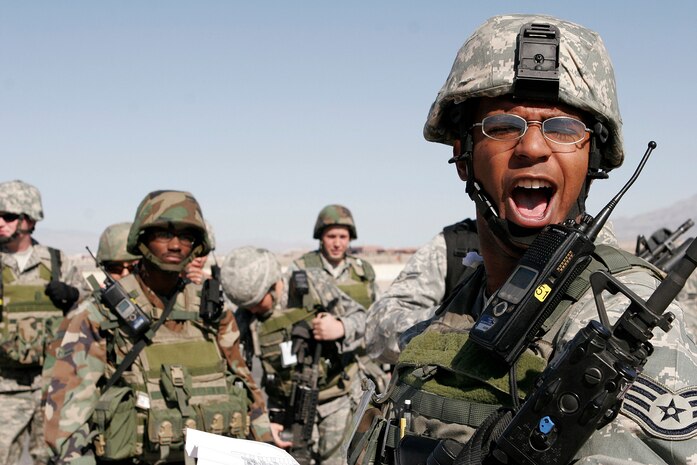 NELLIS AIR FORCE BASE, Nev.—Staff Sgt. Jewayne Johnson, 99th Security Forces Squadron flightline supervisor, prepares his backup augmentation force, also known as a BAF, during an exercise here May 13. All law enforcement and security response team patrols need to be capable to respond to a variety of emergencies. (U.S. Air Force photo/Staff Sgt. Jacob R. McCarthy)