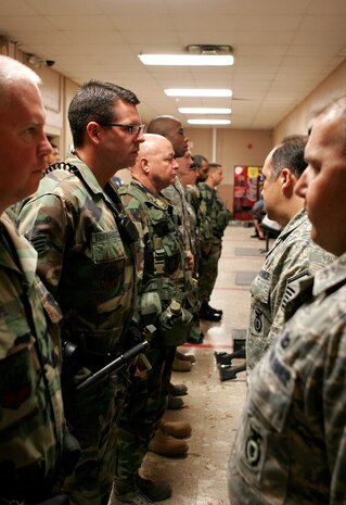 NELLIS AIR FORCE BASE, Nev.—Master Sgt. Carlos Guevara, 99th Security Forces Squadron alpha flight commander, inspects his flight during an open ranks inspection prior to going on post here May 13. These inspections help ensure Airmen are maintain good order and discipline. (U.S. Air Force photo/Staff Sgt. Jacob R. McCarthy)