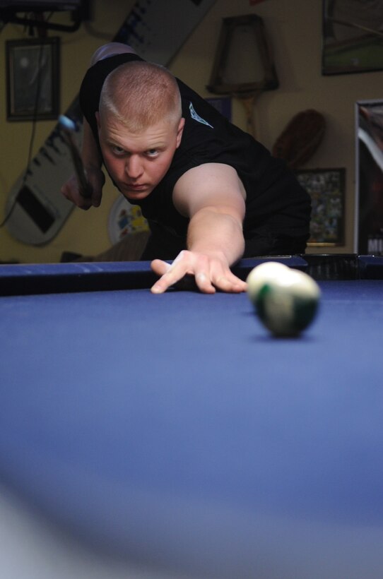 Airman Richard Wyrick, 28th Bomb Wing, 28th Aircraft Maintenance Squadron aircraft armament system specialist, Ellsworth Air Force Base, S.D., takes a straight shot during the first Airmen Billiards tournament at the Black Hills Community Center, May 7, 2008.  The tournament began may 7 and will run through June 25;  finals begin June 28. (U.S. Air Force photo/Senior Airman Anthony Sanchelli)