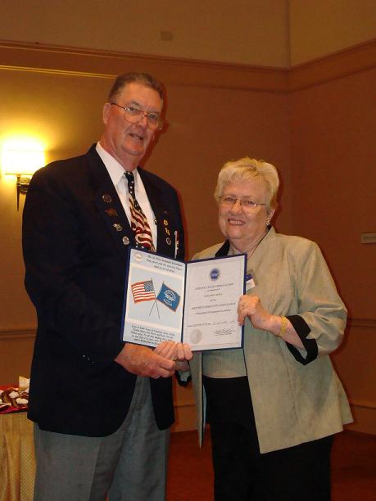 Geraldine Jones, Air Force Sergeants Association Auxiliary Chapter 211 president receives the Presidential Award from Bill McMullen, AFSA Division 2 president.