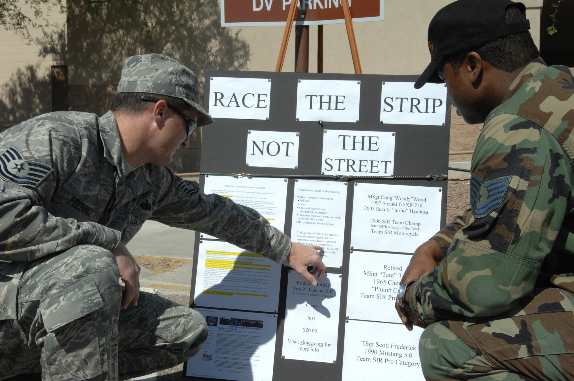 Tech. Sgt. Scott Frederick, 355th Logistics Readiness Squadron, speaks to Tech. Sgt. Jamar Jordan, 355th Fighter Wing Safety, about the dangers of street racing and ways to promote safer alternatives during safety day here, May 16. Safety Day was implemented Air Force wide to bolster safety emphasis and prevent Air Force deaths. (U.S. Air Force photo/Airman 1st Class Noah R. Johnson)